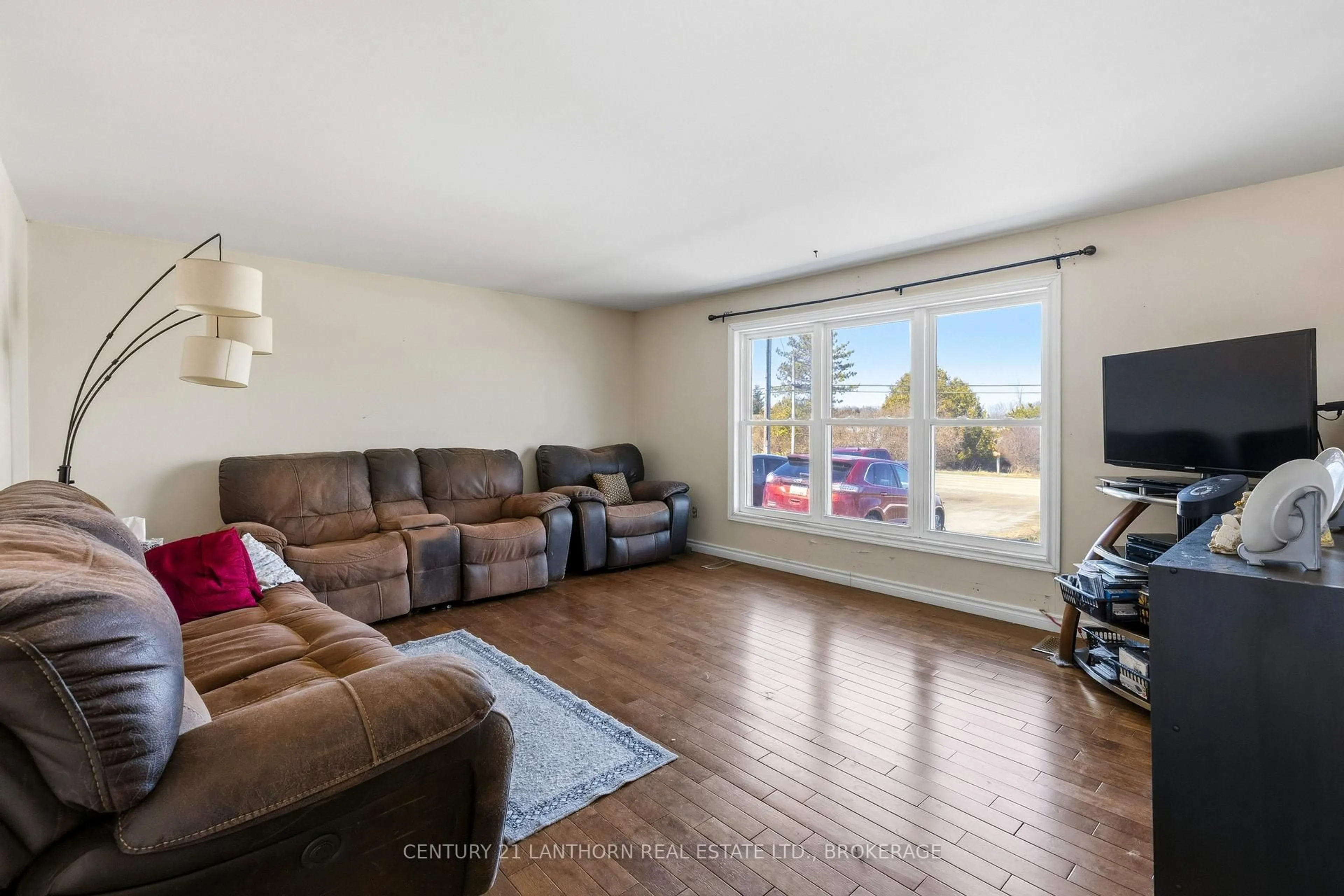 Living room with furniture, wood/laminate floor for 5243 County Road 8, Napanee Ontario K7R 3K7