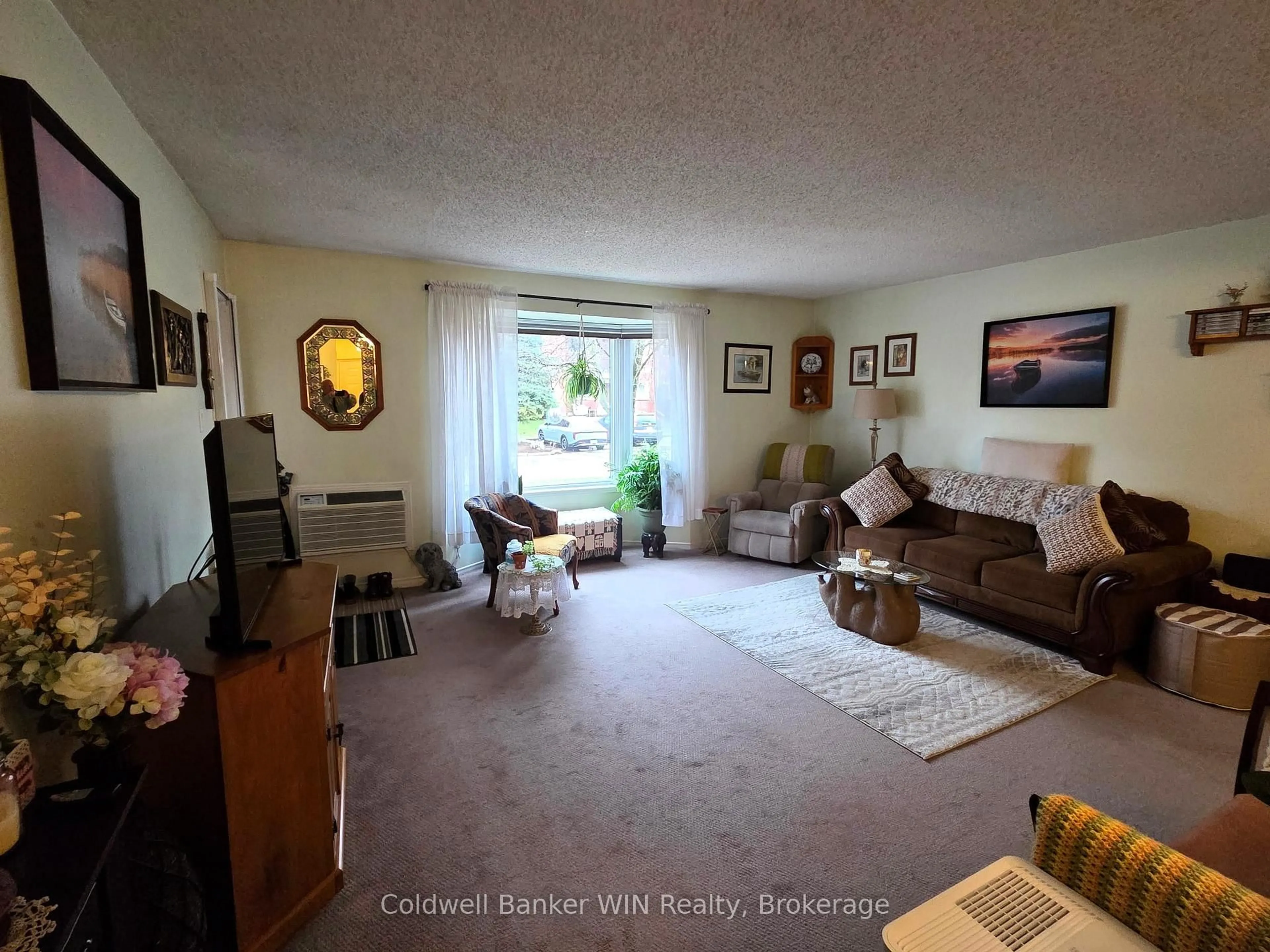 Living room with furniture, unknown for 440 Durham St #108, Wellington North Ontario N0G 2L1