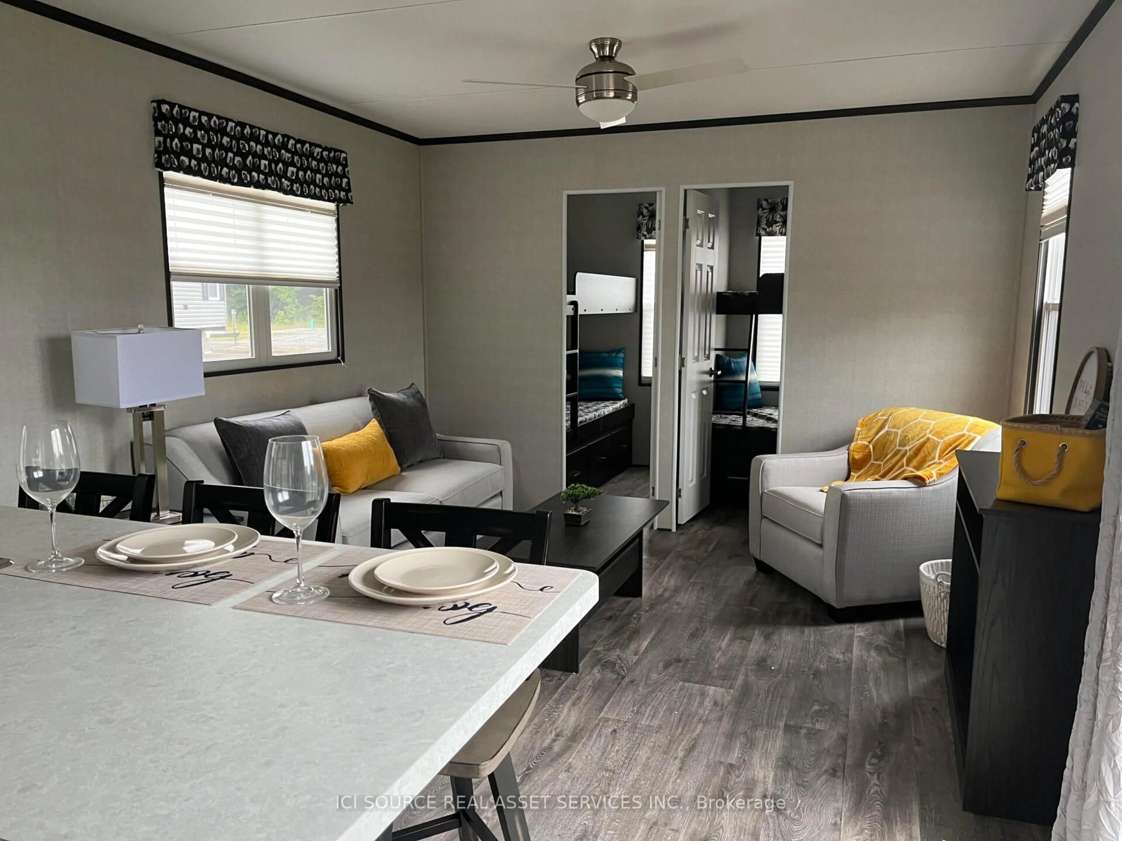 Living room with furniture, wood/laminate floor for 1047 Bonnie Lake Camp Rd #LKR026, Bracebridge Ontario P1L 1W9