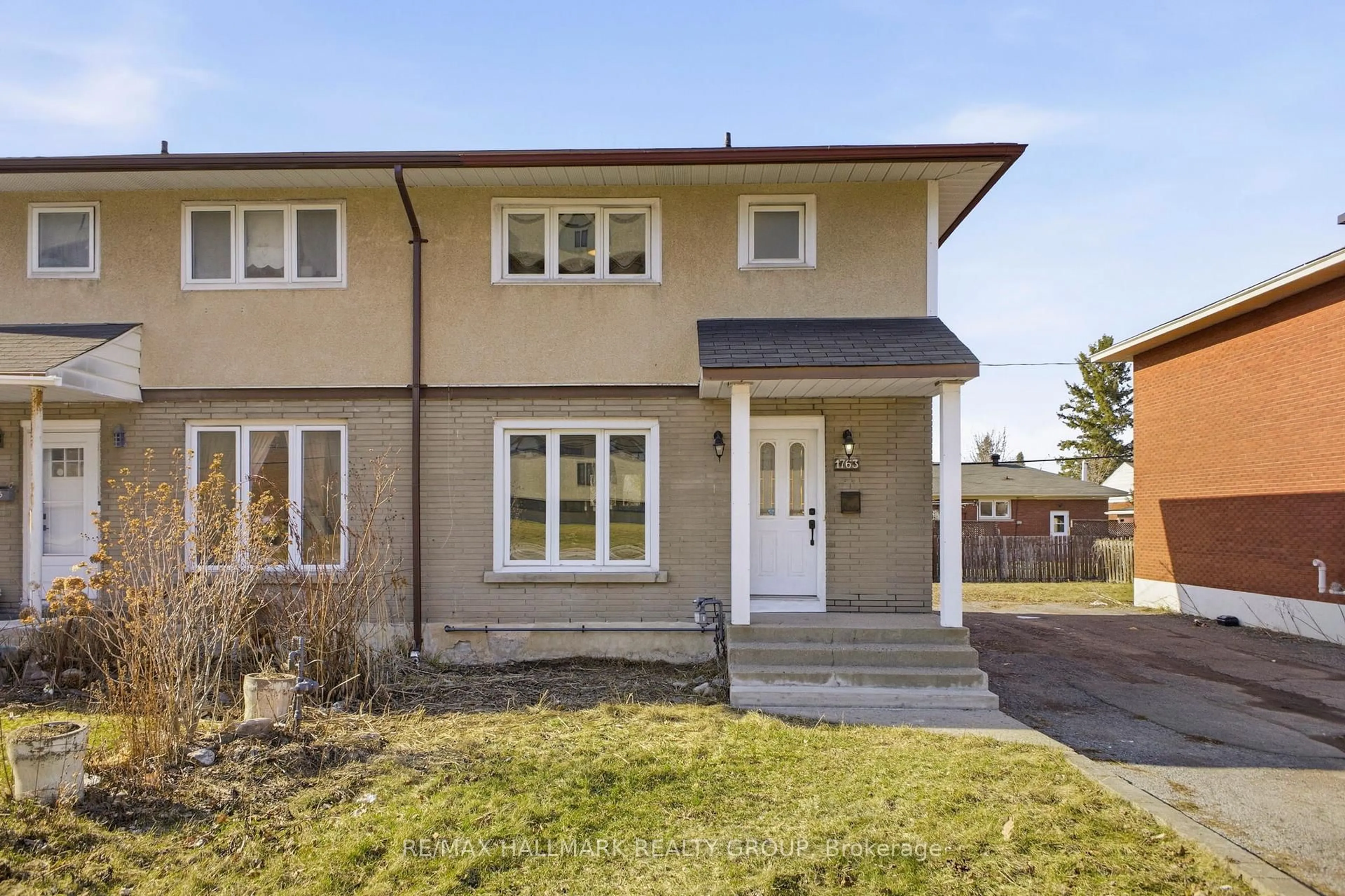 Home with vinyl exterior material, street for 1763 BASELINE Rd, Ottawa Ontario K2C 0C1