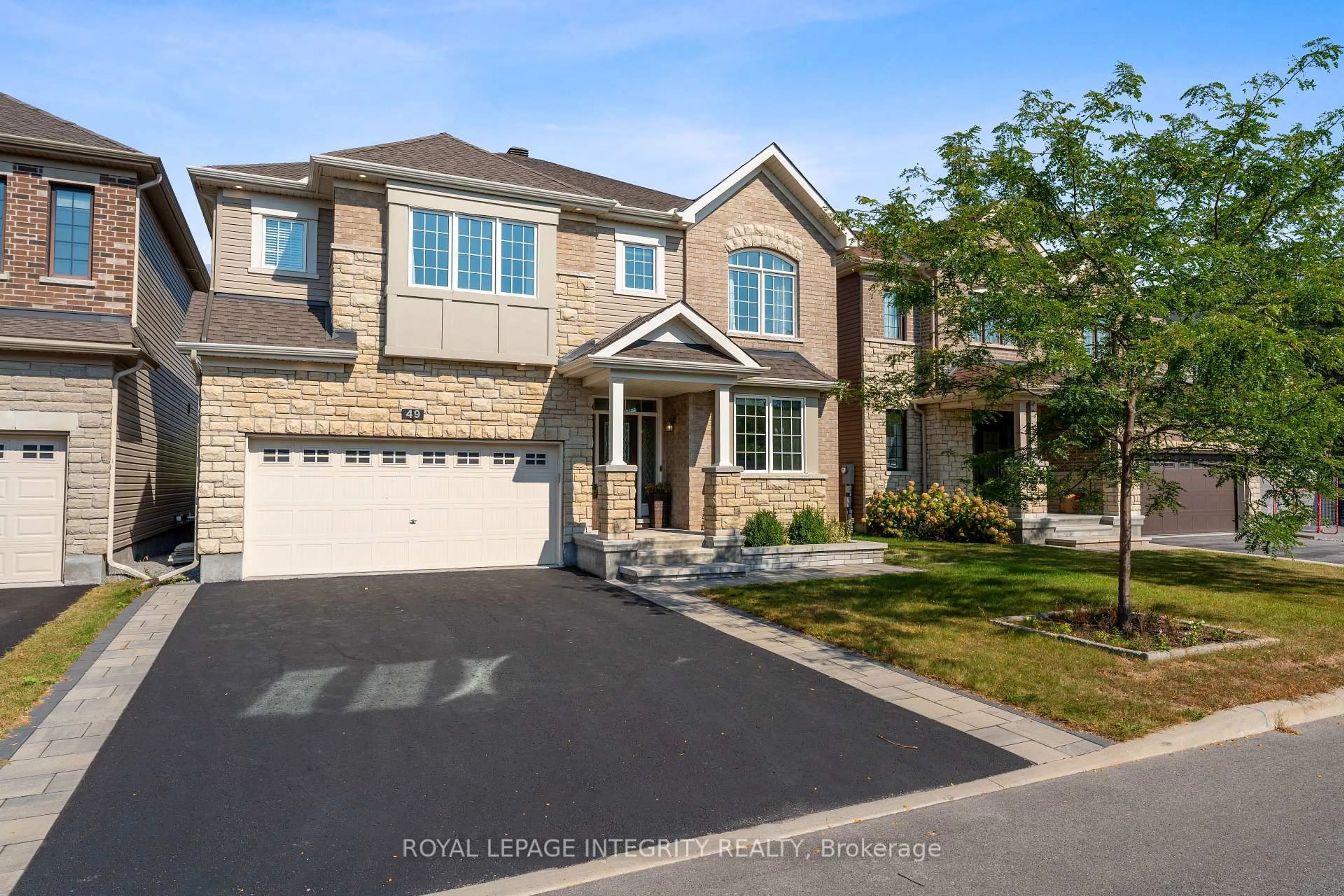 Home with brick exterior material, street for 49 Hawks Landing Cres, Stittsville Ontario K2S 1W1