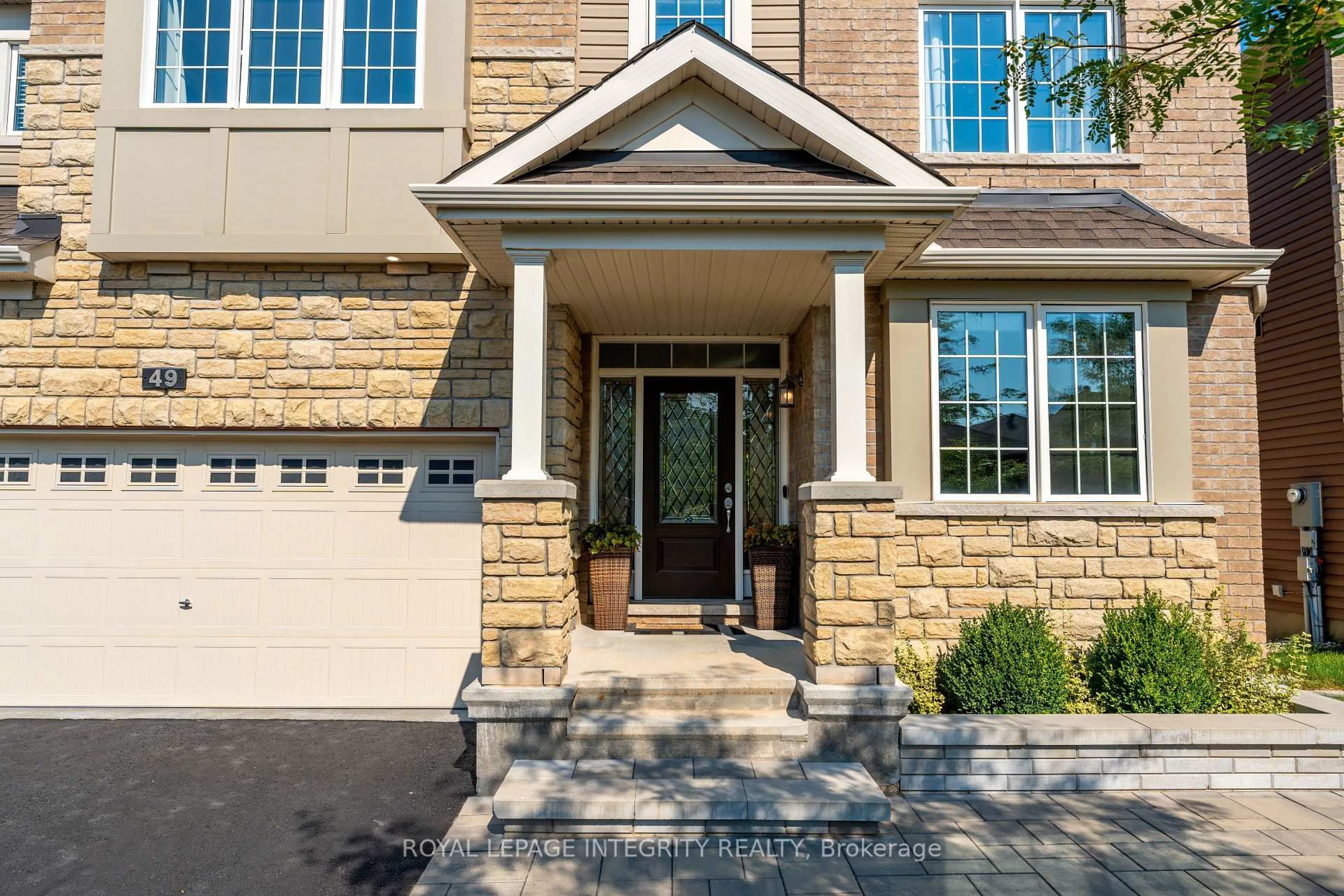 Home with brick exterior material, street for 49 Hawks Landing Cres, Stittsville Ontario K2S 1W1