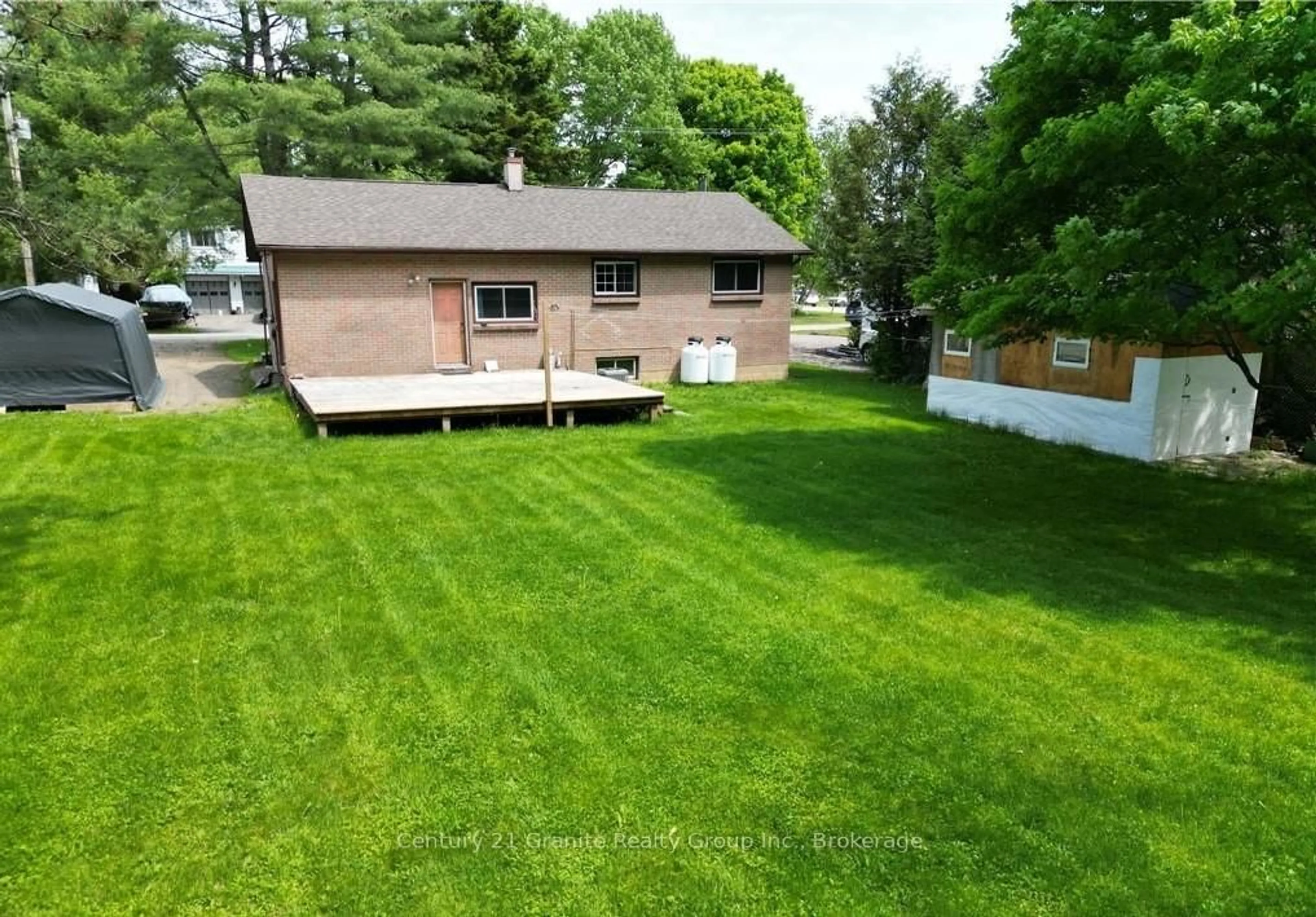 A pic from outside/outdoor area/front of a property/back of a property/a pic from drone, street for 37 Mckay St, Minden Hills Ontario K0M 2K0