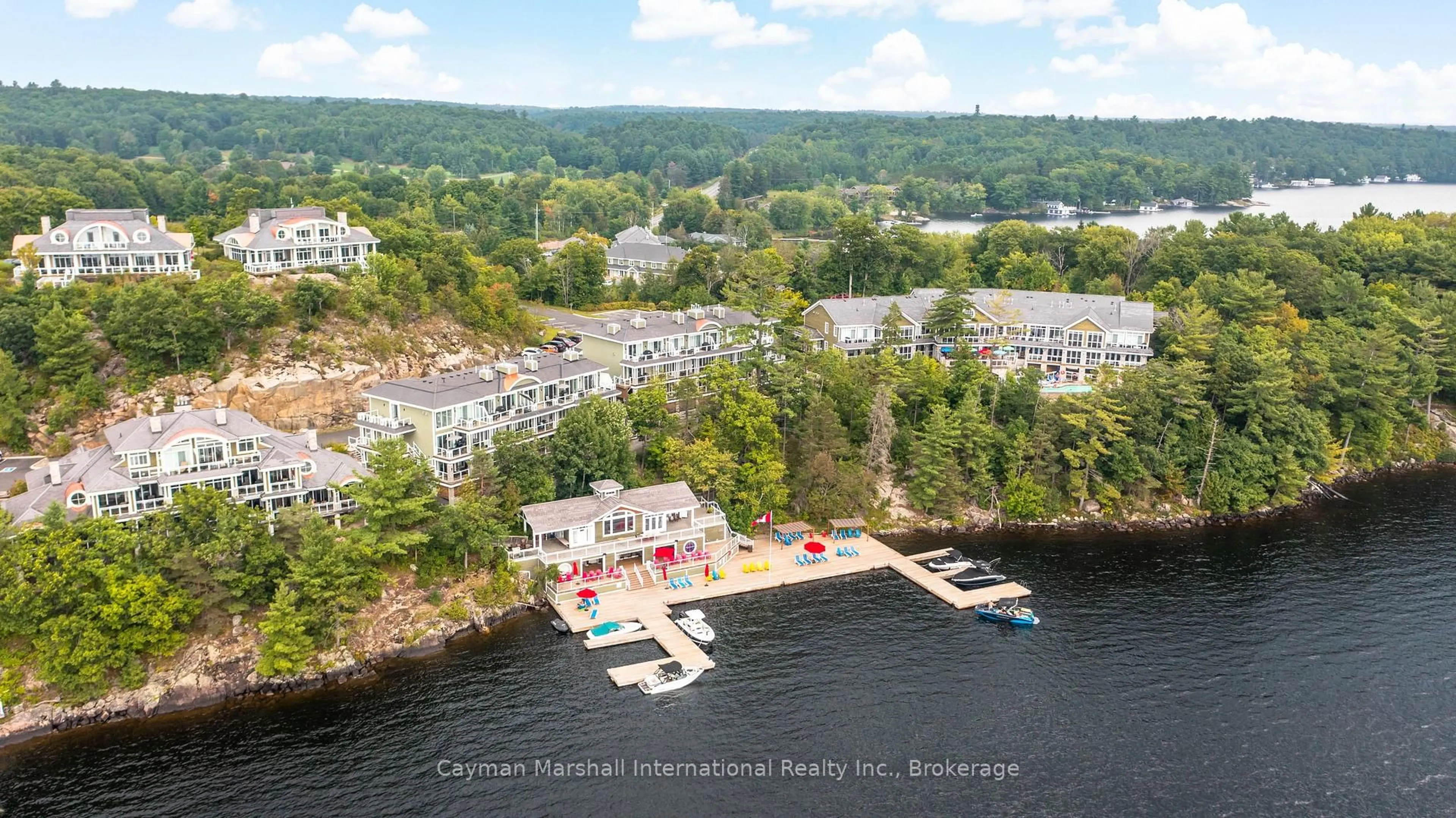 A pic from outside/outdoor area/front of a property/back of a property/a pic from drone, water/lake/river/ocean view for 1869 Muskoka Road HWY 118 #BTV-E106, Muskoka Lakes Ontario P1L 1W8