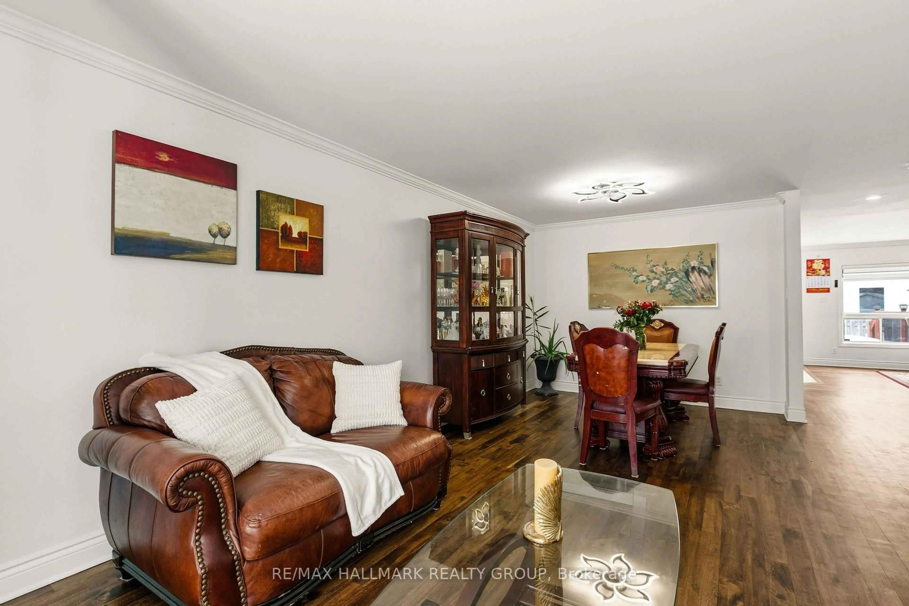 Living room with furniture, wood/laminate floor for 340 Stoneway Dr, Ottawa Ontario K2G 6G8