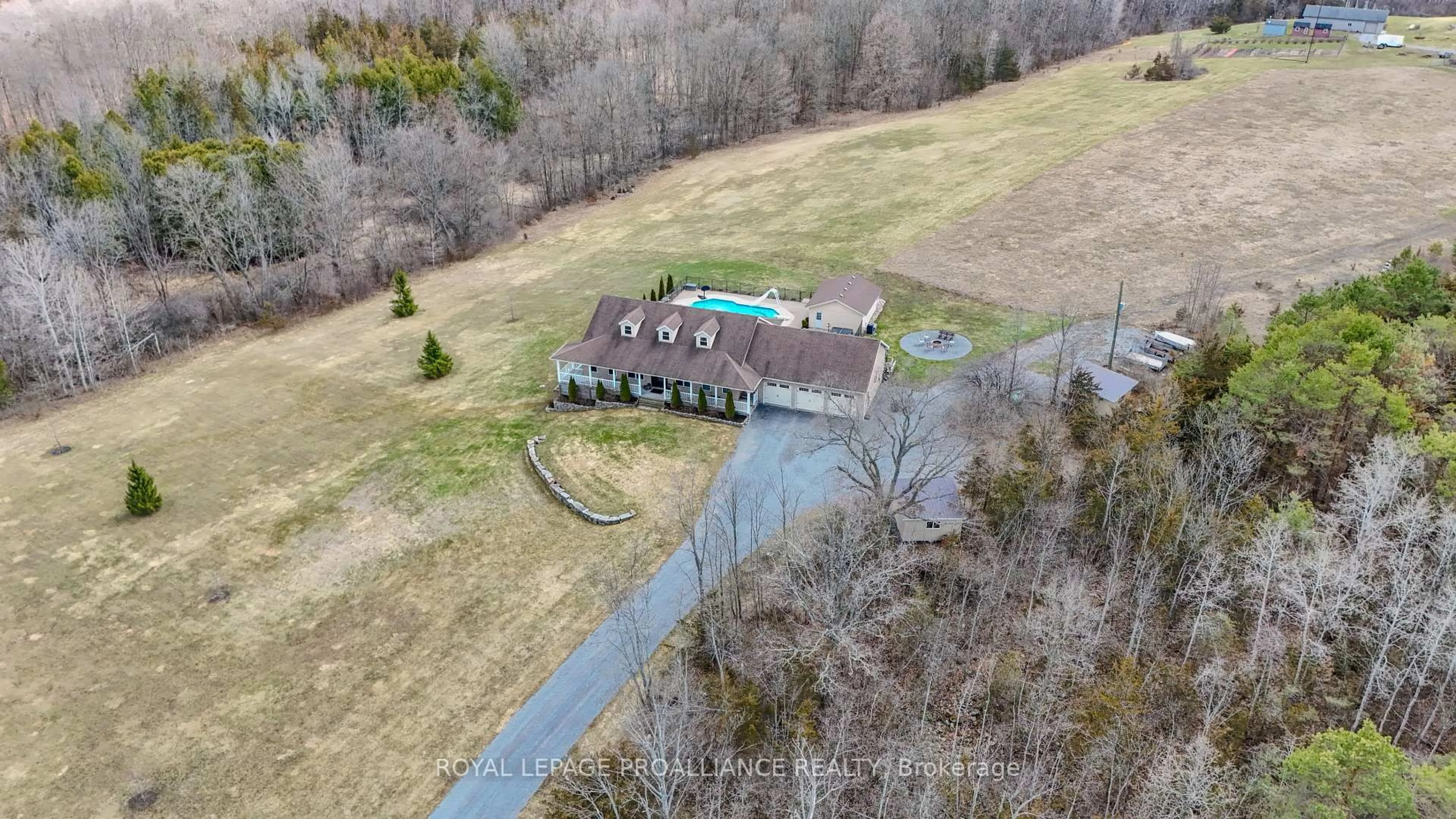 A pic from outside/outdoor area/front of a property/back of a property/a pic from drone, water/lake/river/ocean view for 2104 Highway 37 #A, Belleville Ontario K0K 2V0