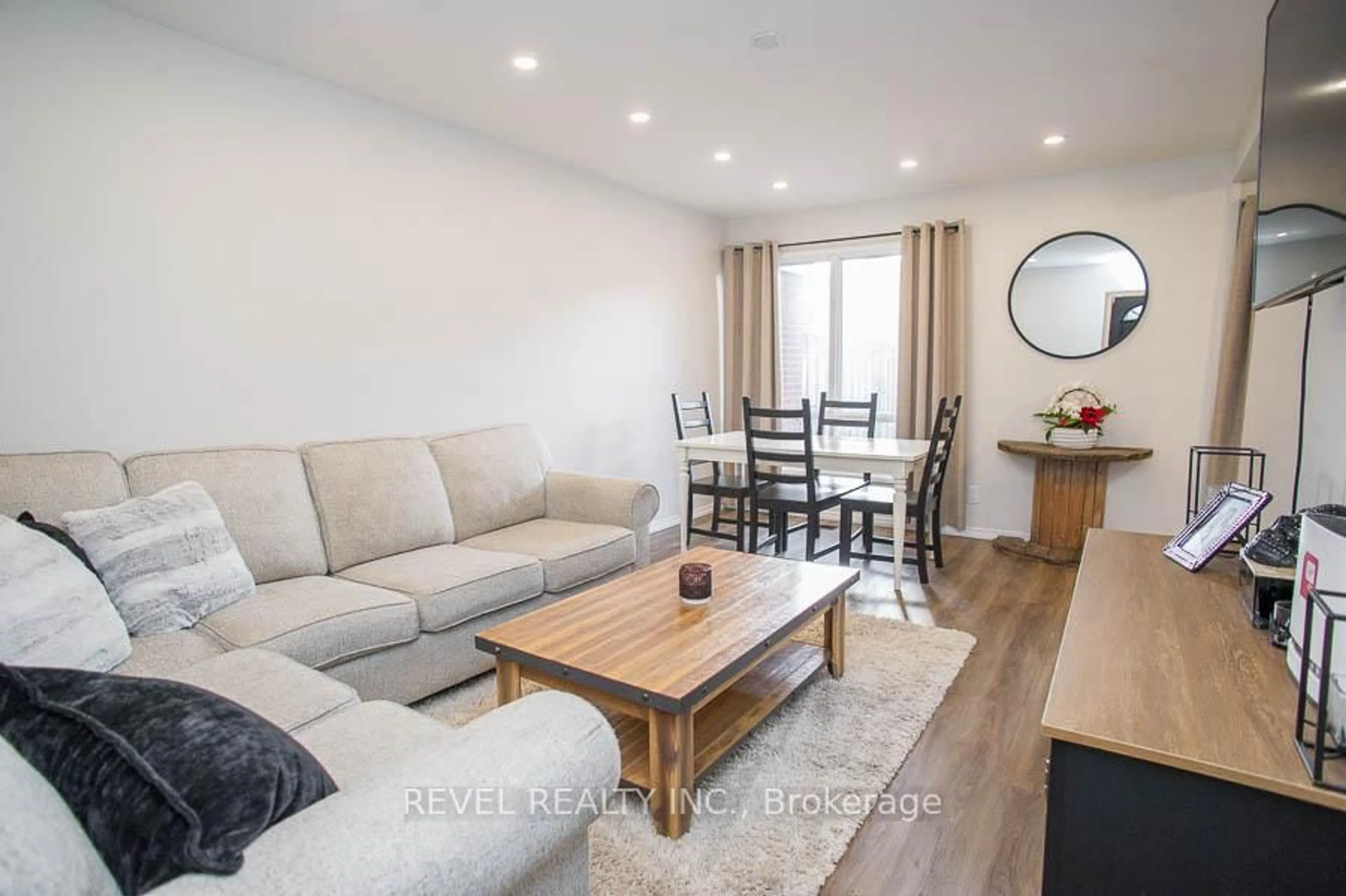 Living room with furniture, wood/laminate floor for 273 Elgin St #52, Brantford Ontario N3S 5B2