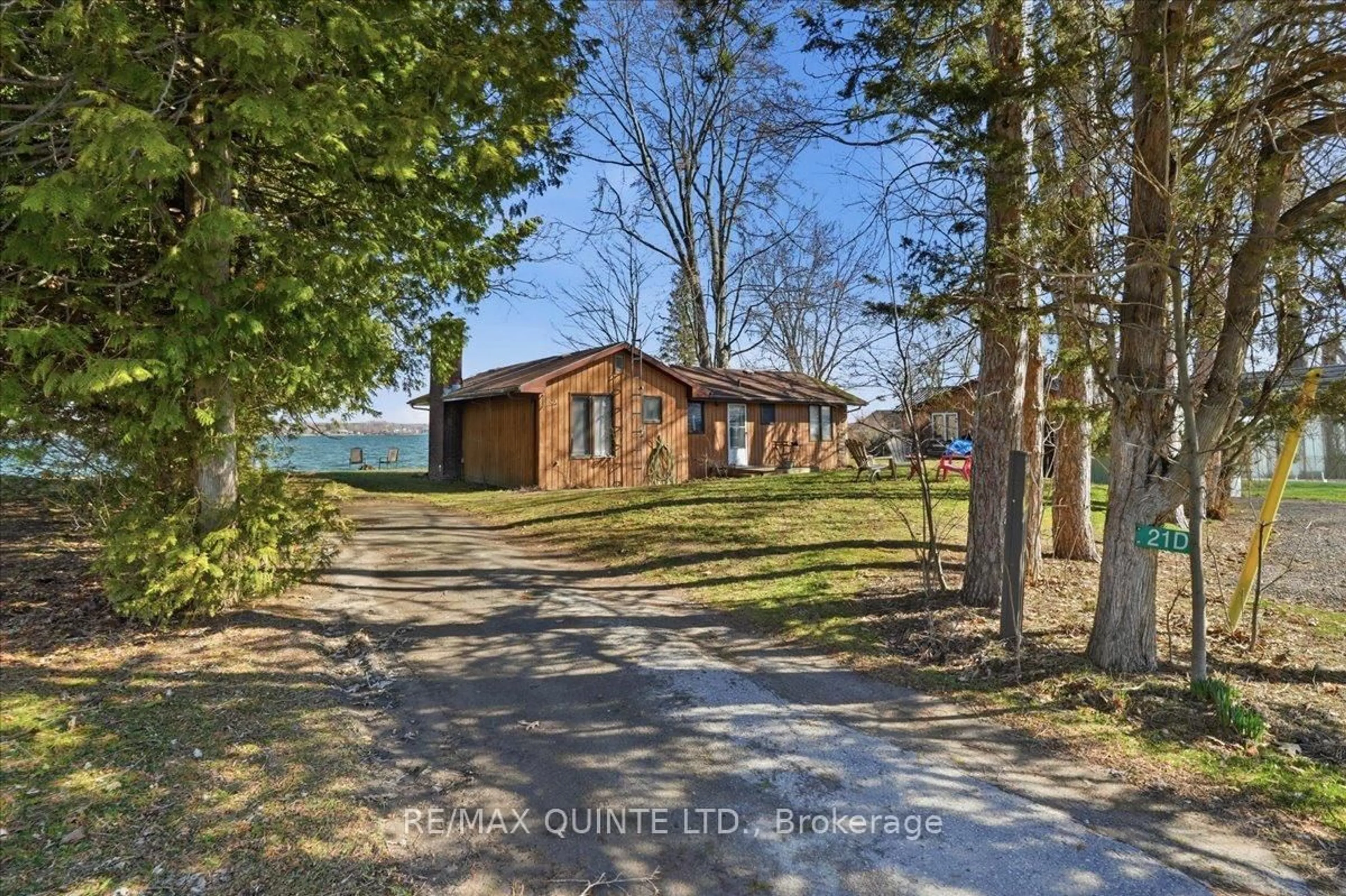 A pic from outside/outdoor area/front of a property/back of a property/a pic from drone, water/lake/river/ocean view for 21D Willoughby Lane, Prince Edward County Ontario K0K 2P0
