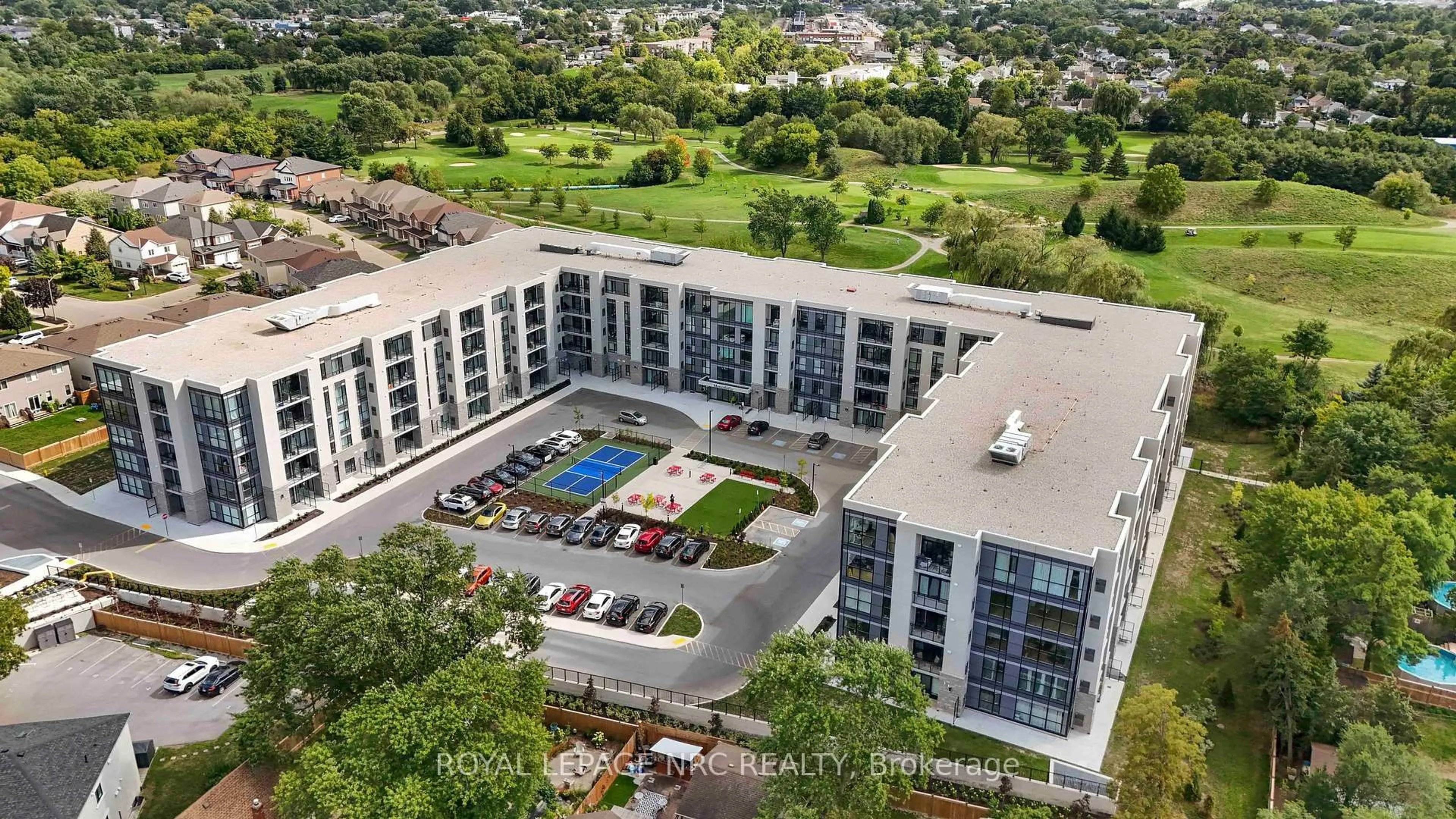 A pic from outside/outdoor area/front of a property/back of a property/a pic from drone, city buildings view from balcony for 50 Herrick Ave #LP45, St. Catharines Ontario L2P 0G3