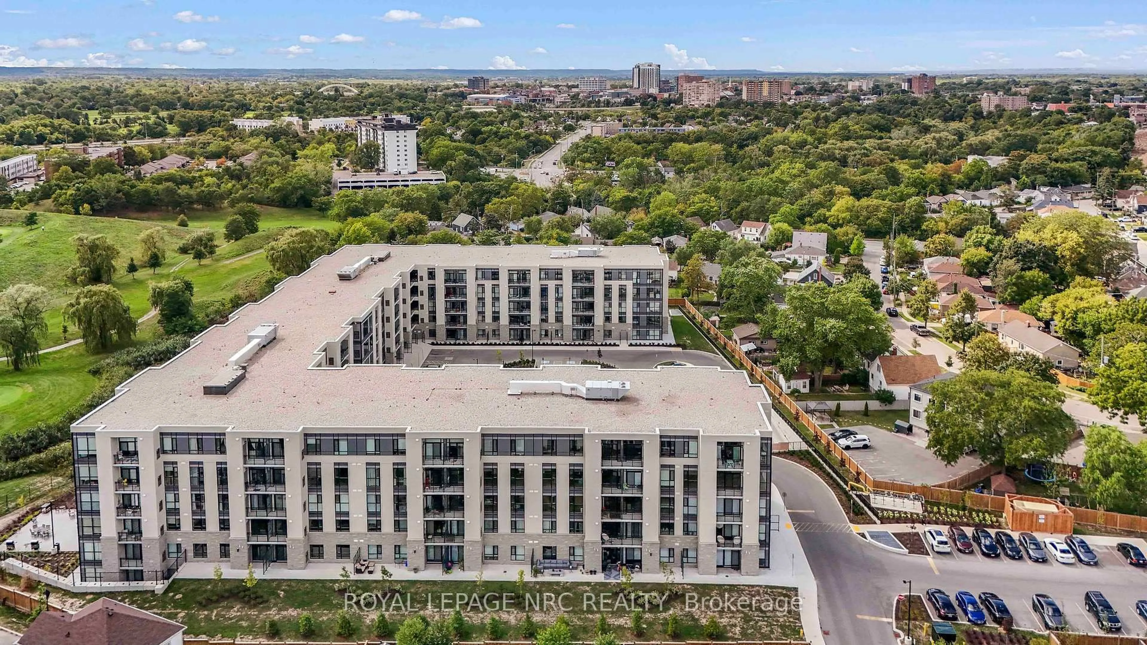 A pic from outside/outdoor area/front of a property/back of a property/a pic from drone, city buildings view from balcony for 50 Herrick Ave #LP45, St. Catharines Ontario L2P 0G3