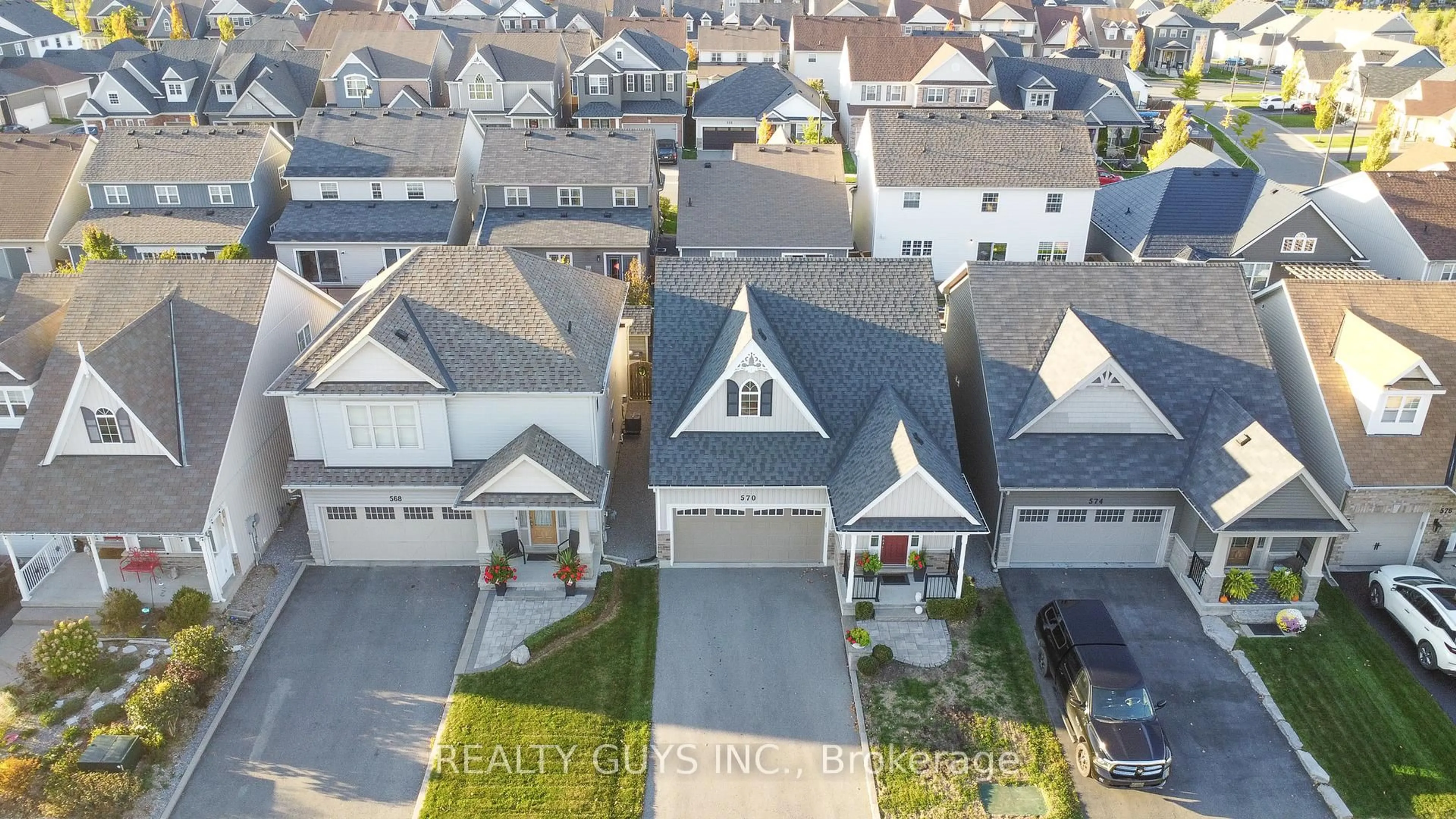 A pic from outside/outdoor area/front of a property/back of a property/a pic from drone, street for 570 Grange Way, Peterborough Ontario K9H 0G5