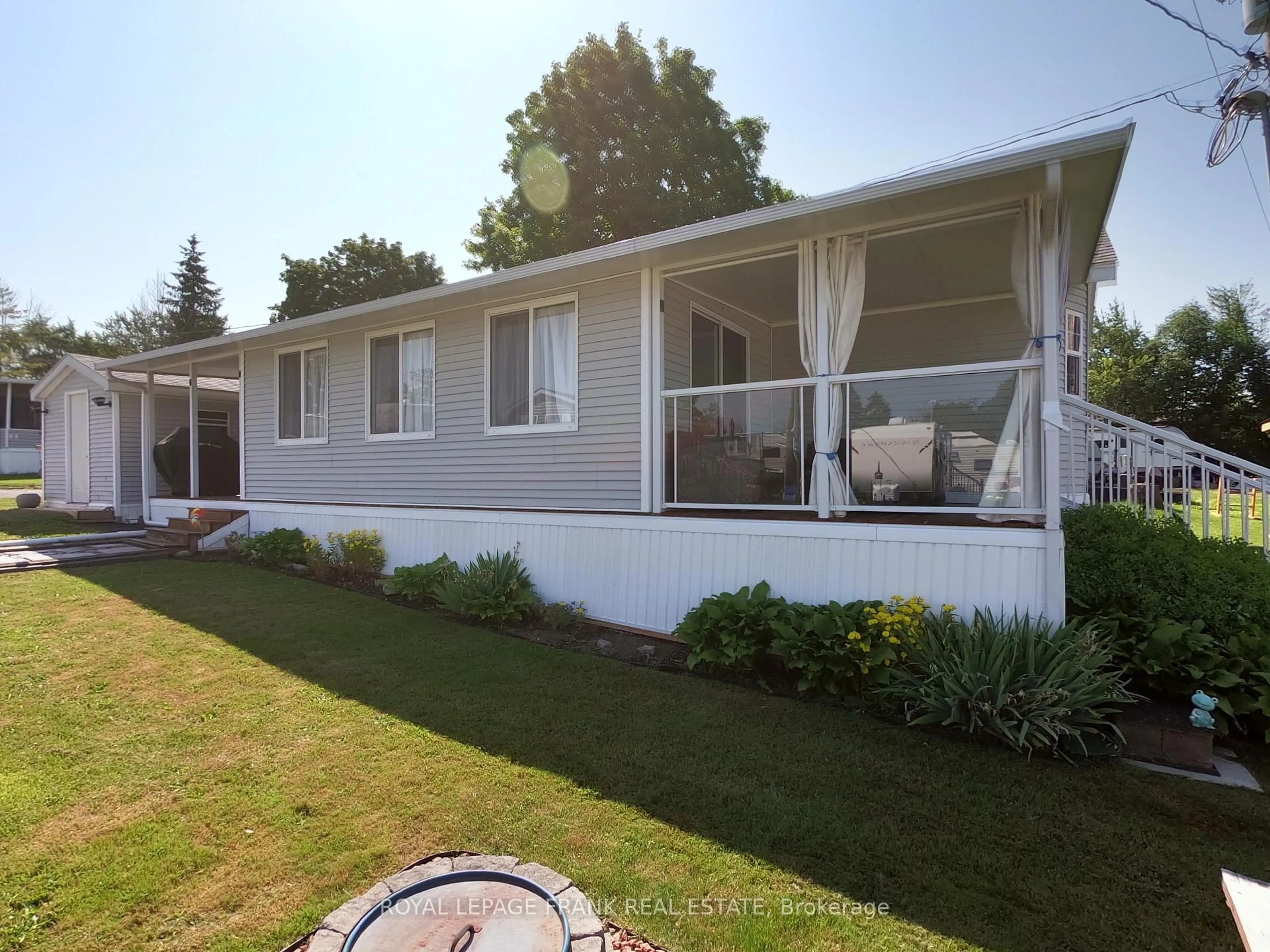 Home with vinyl exterior material, street for 14 Pioneer Dr, Otonabee-South Monaghan Ontario K0L 2G0