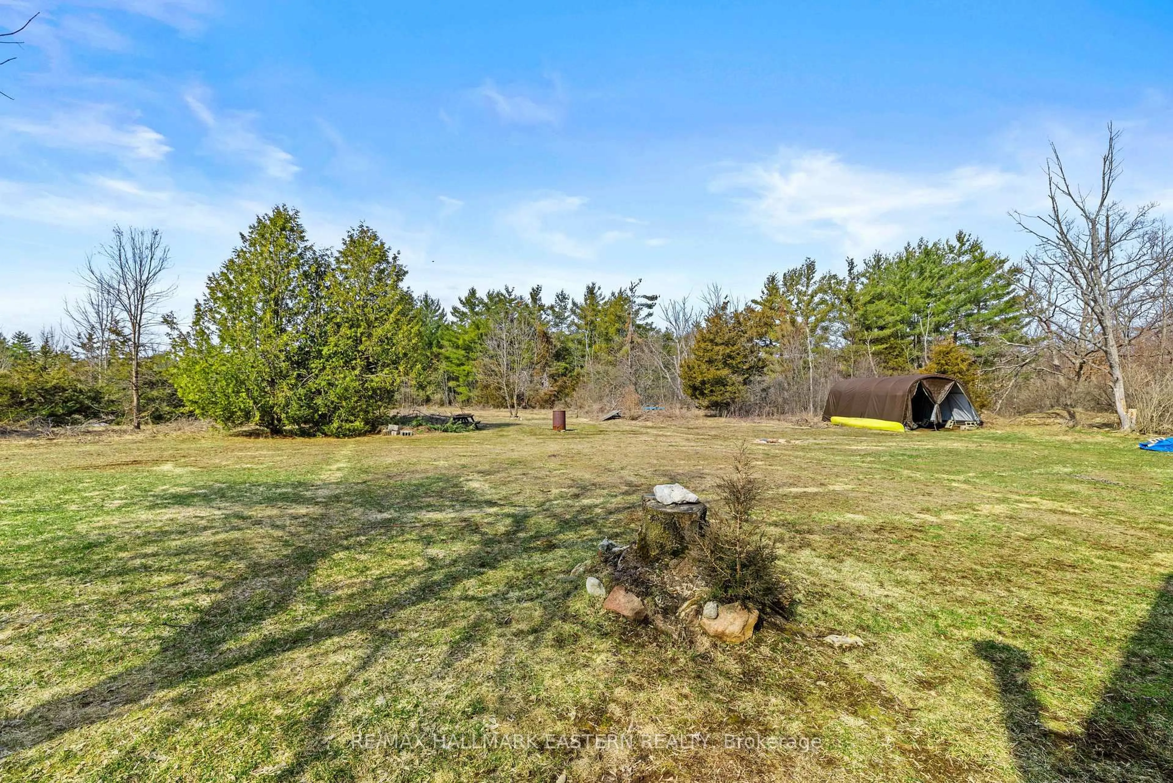 A pic from outside/outdoor area/front of a property/back of a property/a pic from drone, forest/trees view for 700 Golf Course Rd, Douro-Dummer Ontario K0L 2H0