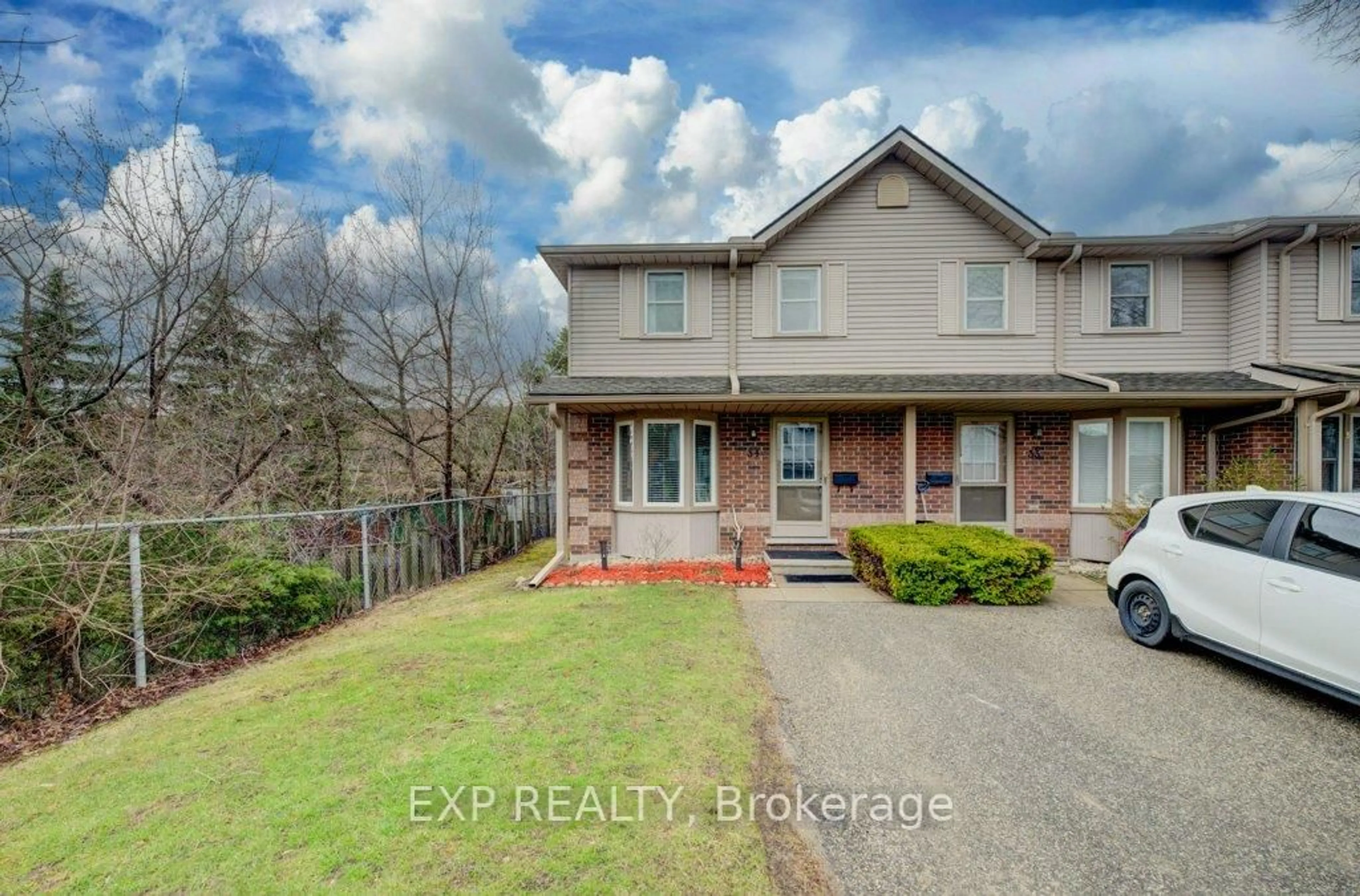 A pic from outside/outdoor area/front of a property/back of a property/a pic from drone, street for 180 Marksam Rd #34, Guelph Ontario N1H 8G5