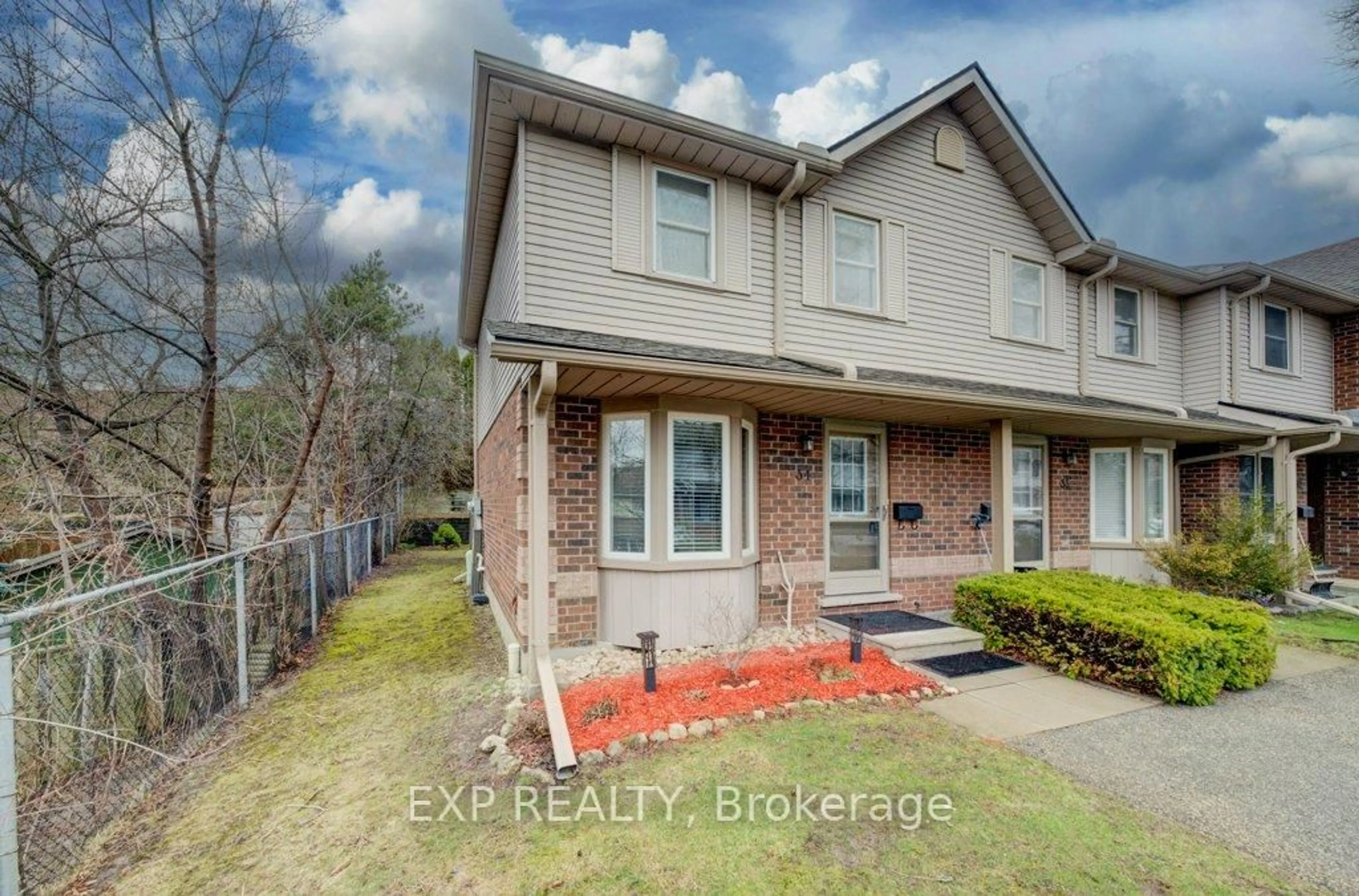 Home with brick exterior material, street for 180 Marksam Rd #34, Guelph Ontario N1H 8G5