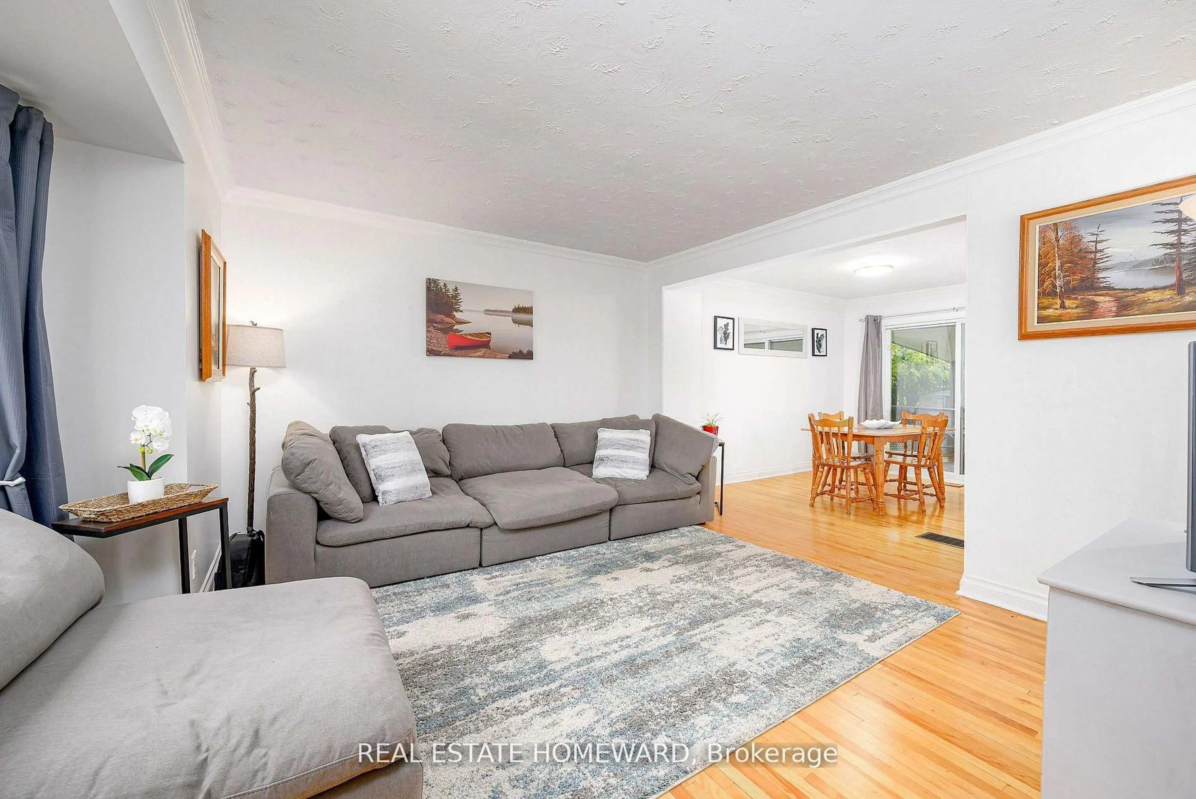 Living room with furniture, wood/laminate floor for 521 O'Connell Rd, Peterborough Ontario K9J 4E2