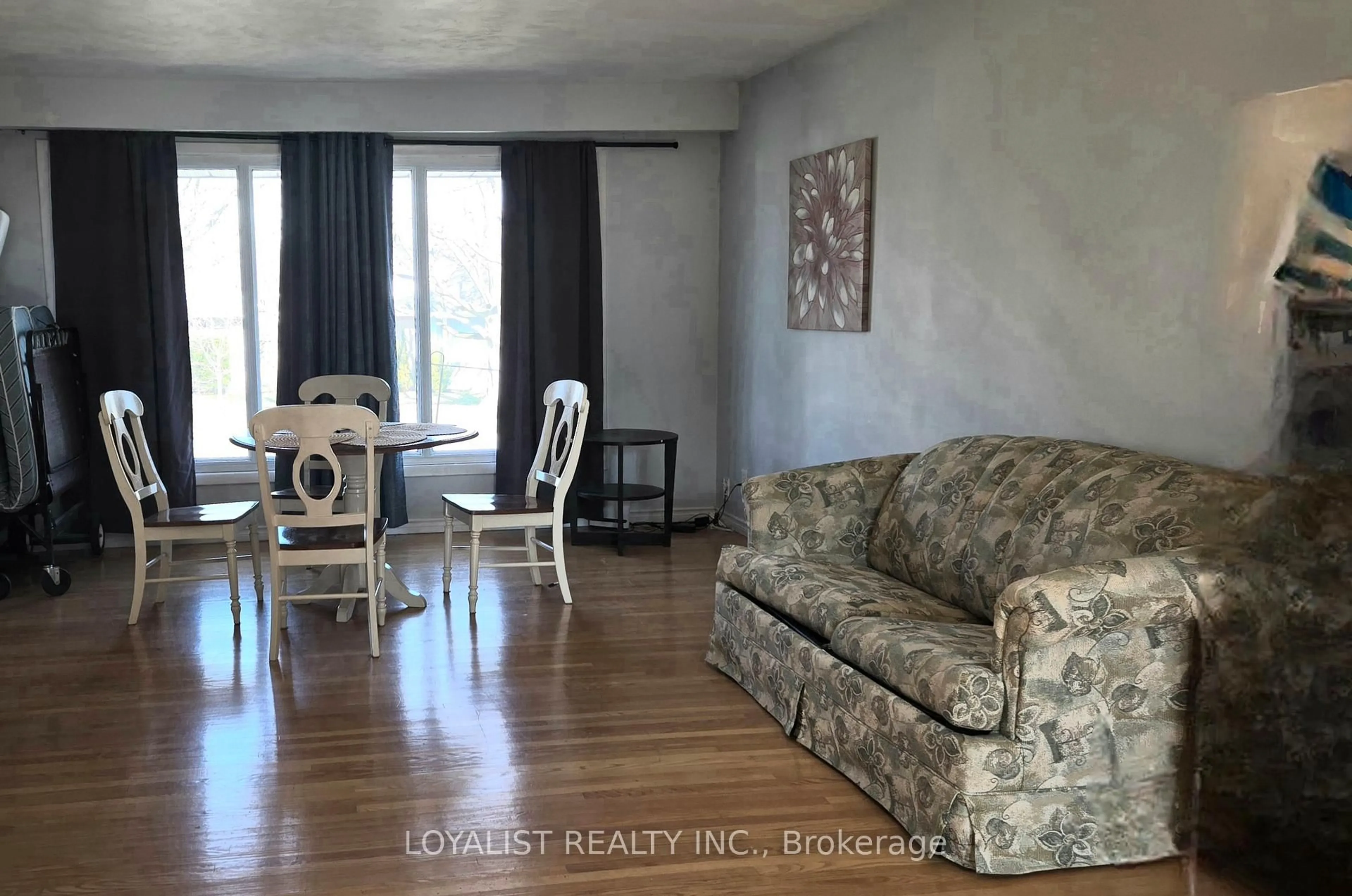 Living room with furniture, wood/laminate floor for 220 PARROTT Dr, Belleville Ontario K8N 4N9