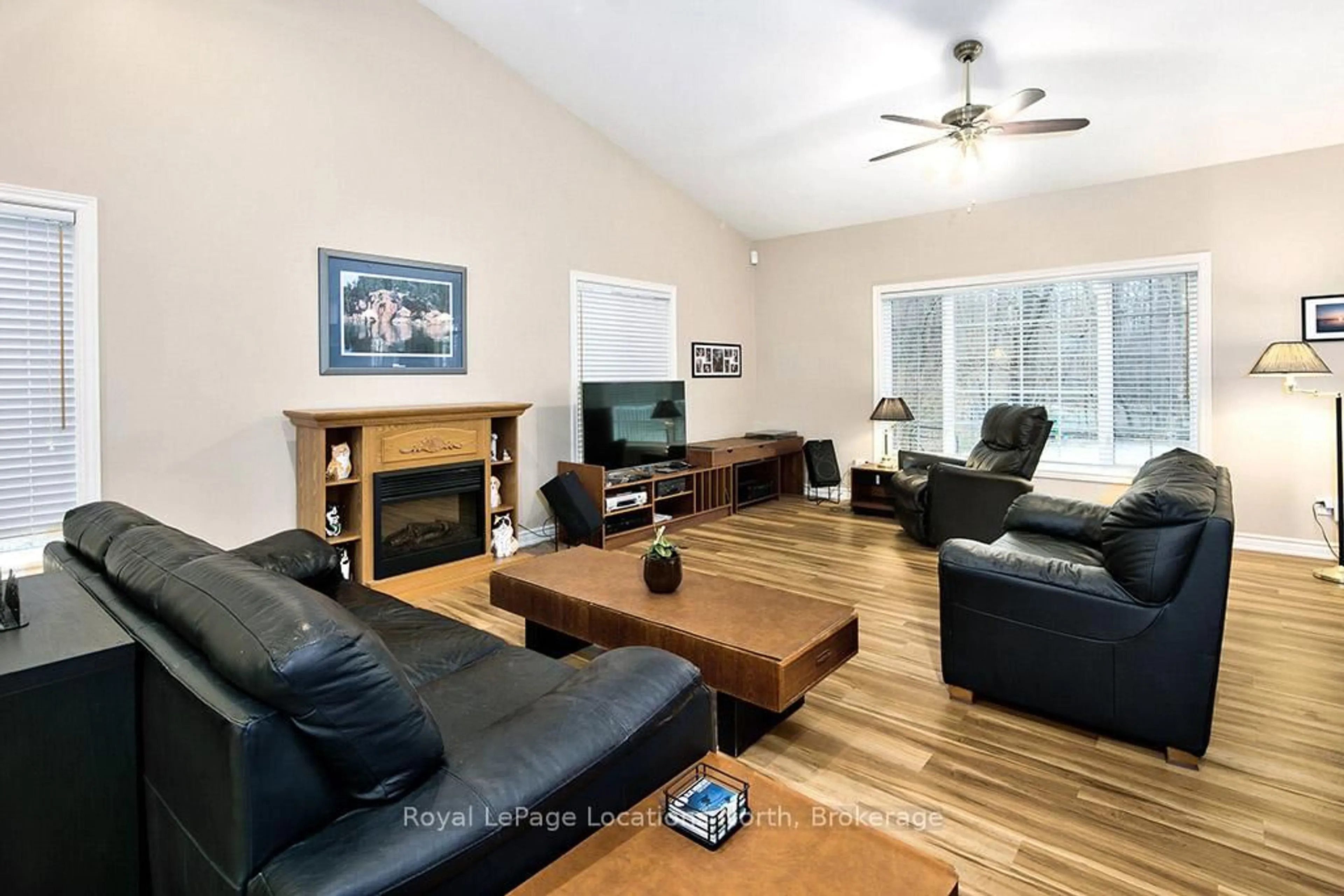 Living room with furniture, wood/laminate floor for 120 Wards Rd, Blue Mountains Ontario L9Y 0T7