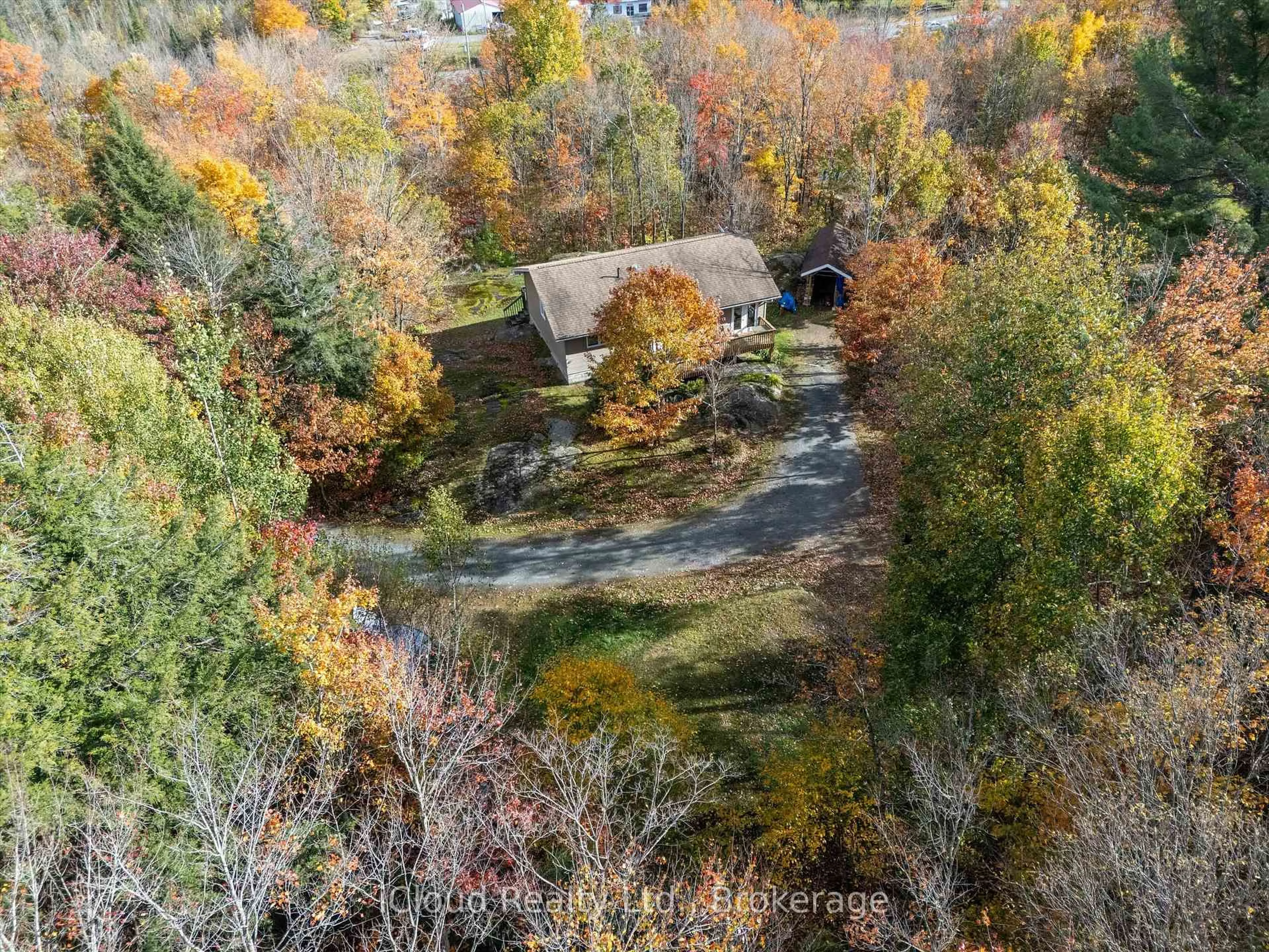 A pic from outside/outdoor area/front of a property/back of a property/a pic from drone, forest/trees view for 6 Springhill Rd, McKellar Ontario P0G 1C0