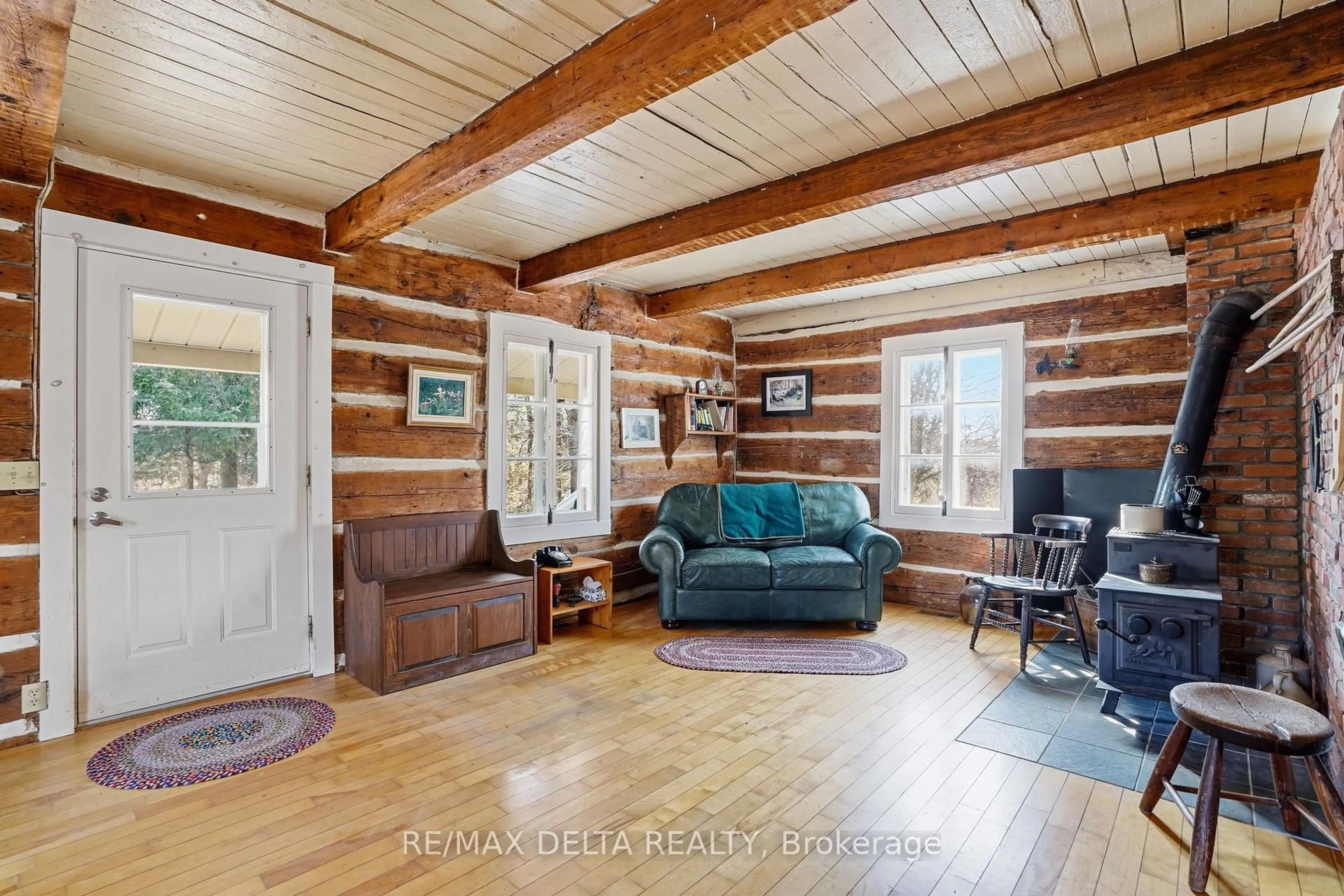 Living room with furniture, wood/laminate floor for 2392 North Dixon Factory Rd, The Nation Ontario K0A 1E0