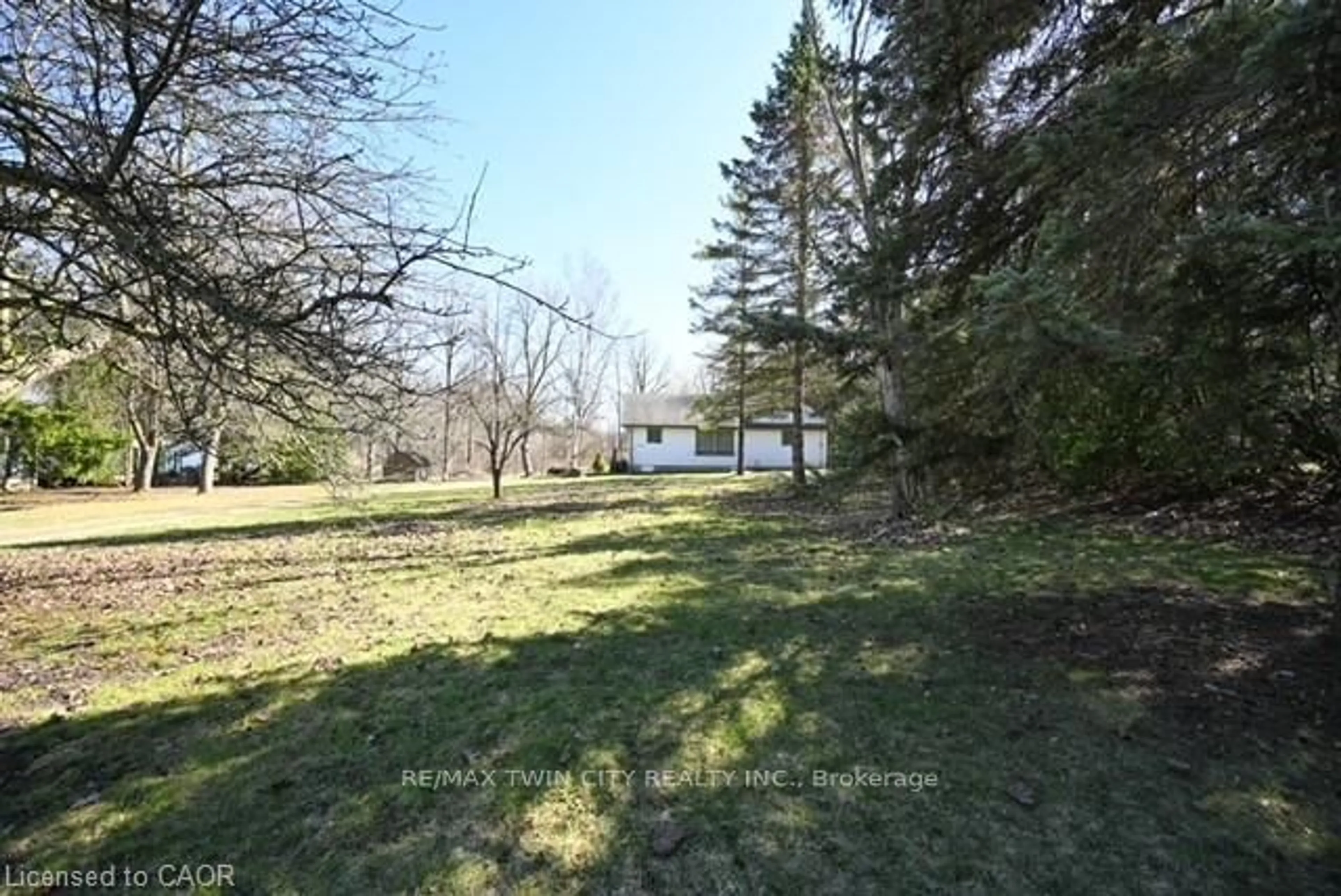 A pic from outside/outdoor area/front of a property/back of a property/a pic from drone, forest/trees view for 1145 Main St, Cambridge Ontario N1R 5S7