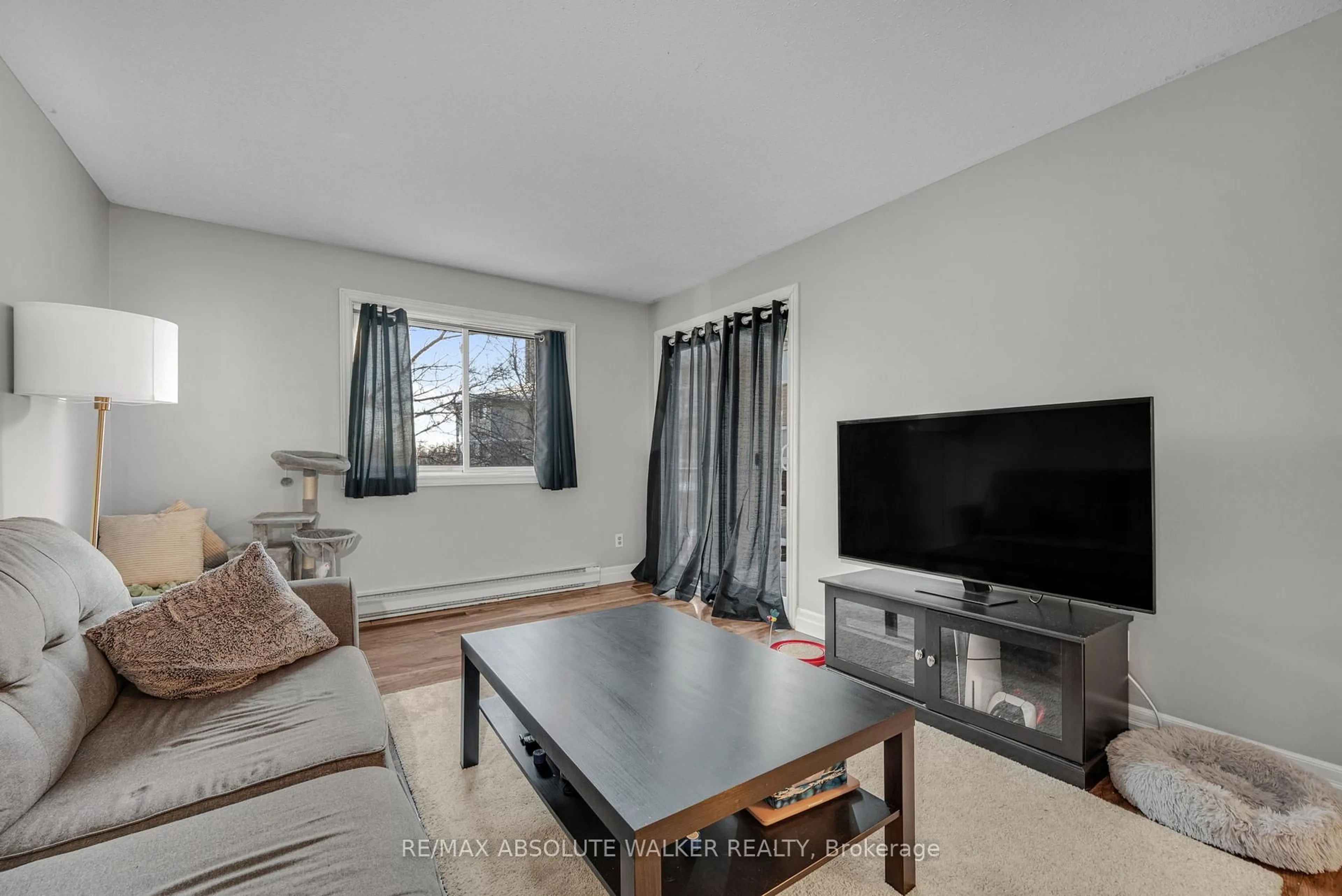 Living room with furniture, unknown for 250 Brittany Dr #318, Ottawa Ontario K1K 4M1