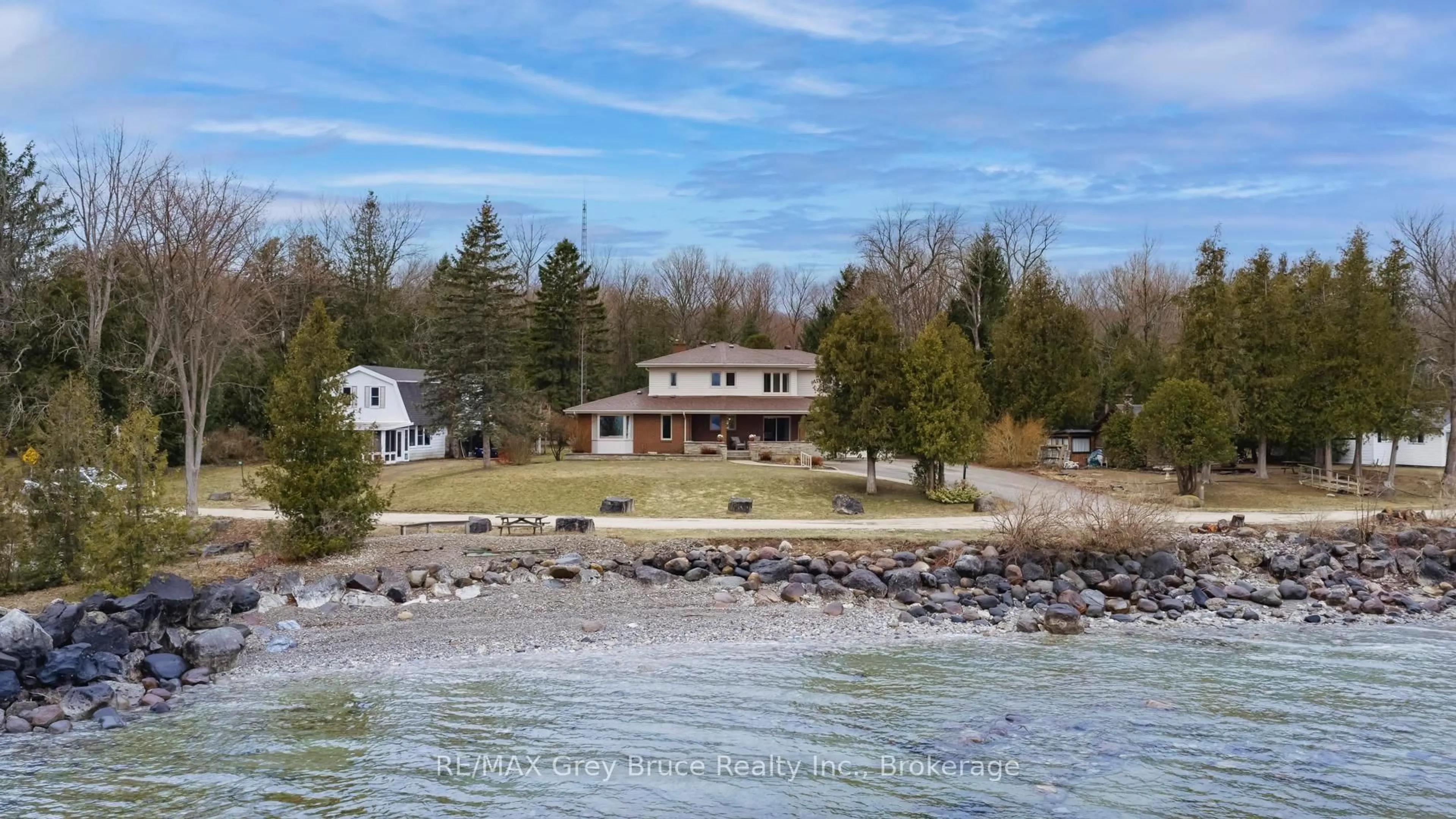 A pic from outside/outdoor area/front of a property/back of a property/a pic from drone, water/lake/river/ocean view for 122 Cottage Lane, Georgian Bluffs Ontario N4K 5N4