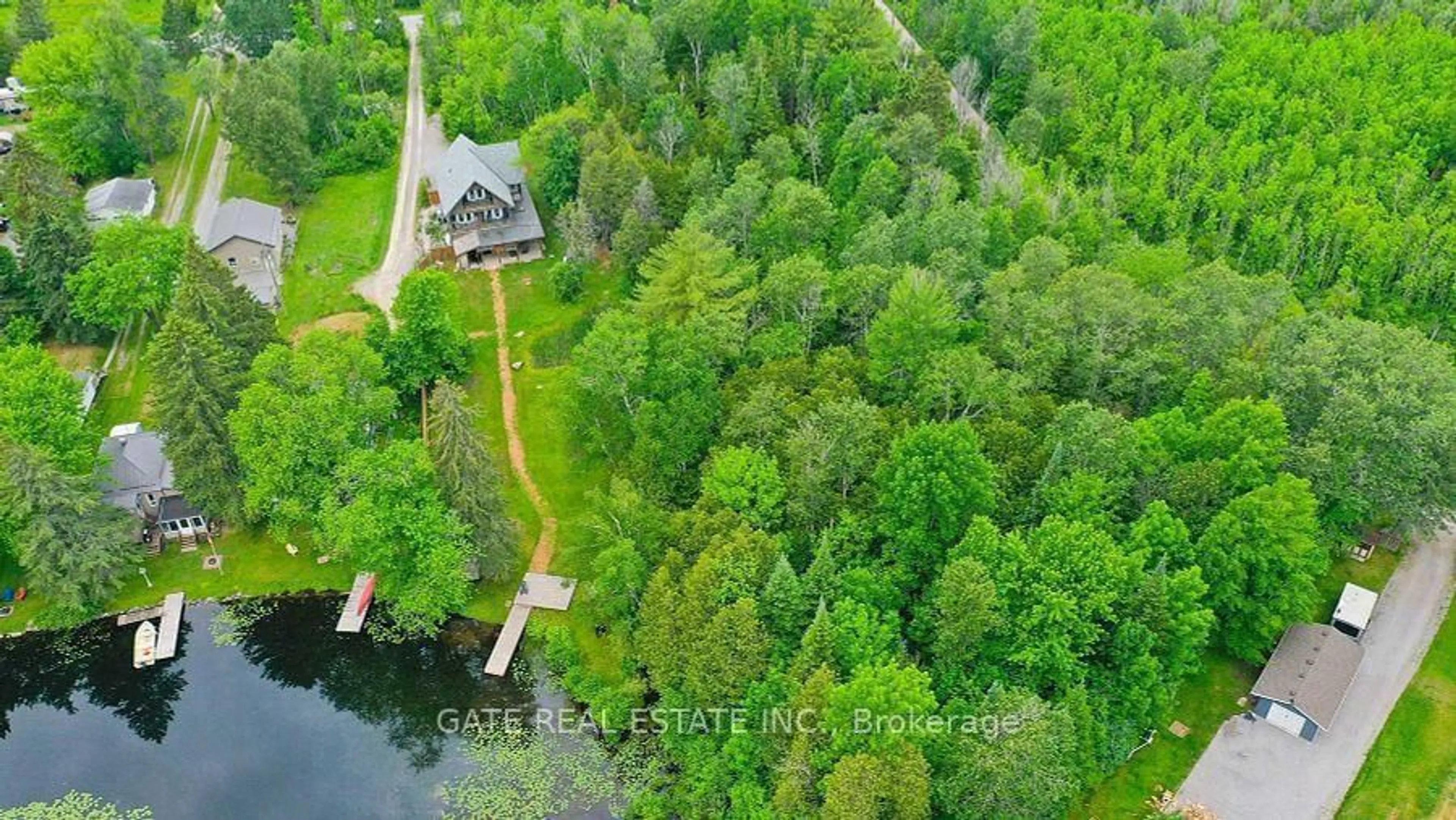 A pic from outside/outdoor area/front of a property/back of a property/a pic from drone, water/lake/river/ocean view for 44 Bass Lake Rd, Trent Lakes Ontario K0M 1A0