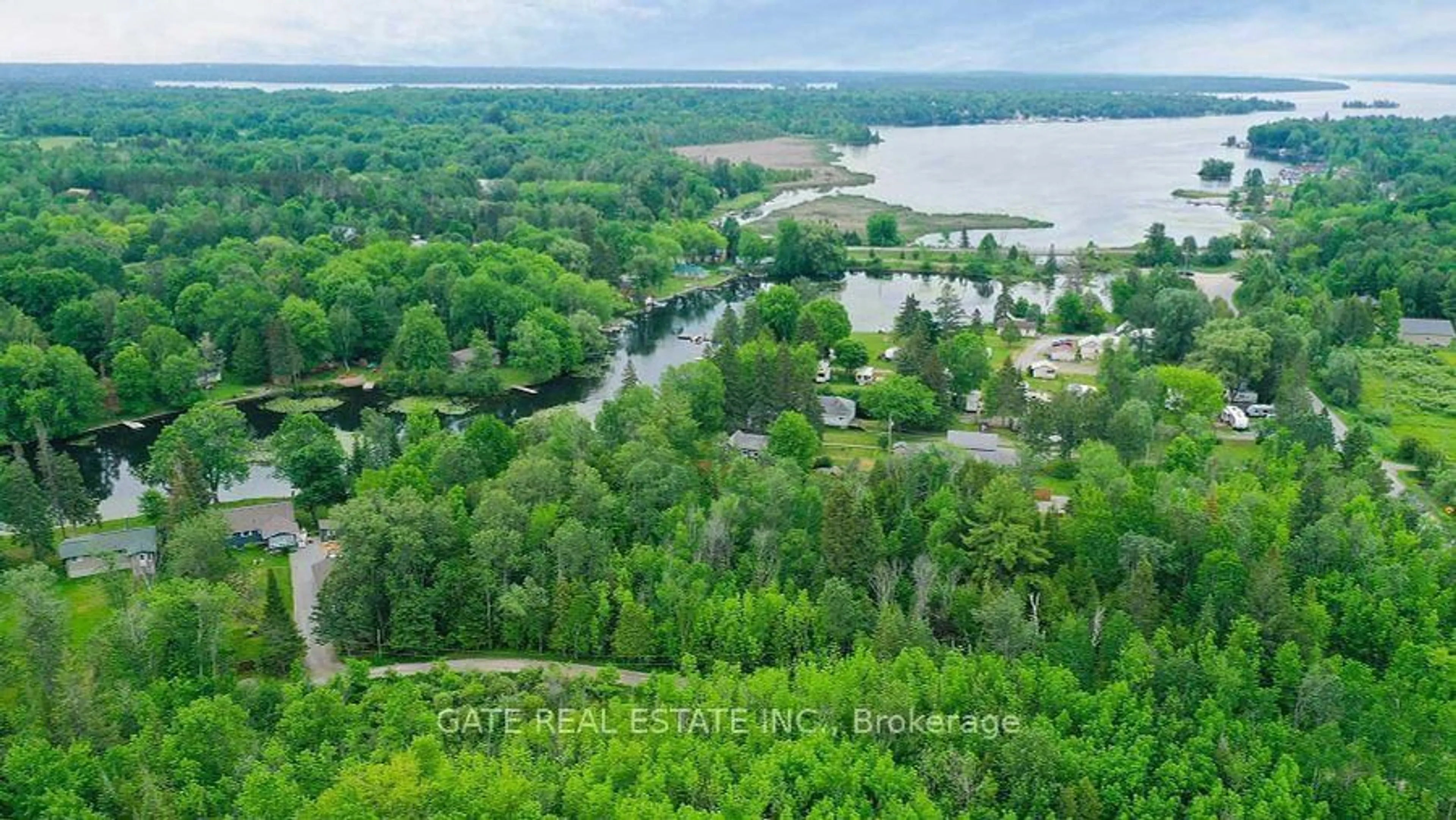 A pic from outside/outdoor area/front of a property/back of a property/a pic from drone, water/lake/river/ocean view for 44 Bass Lake Rd, Trent Lakes Ontario K0M 1A0