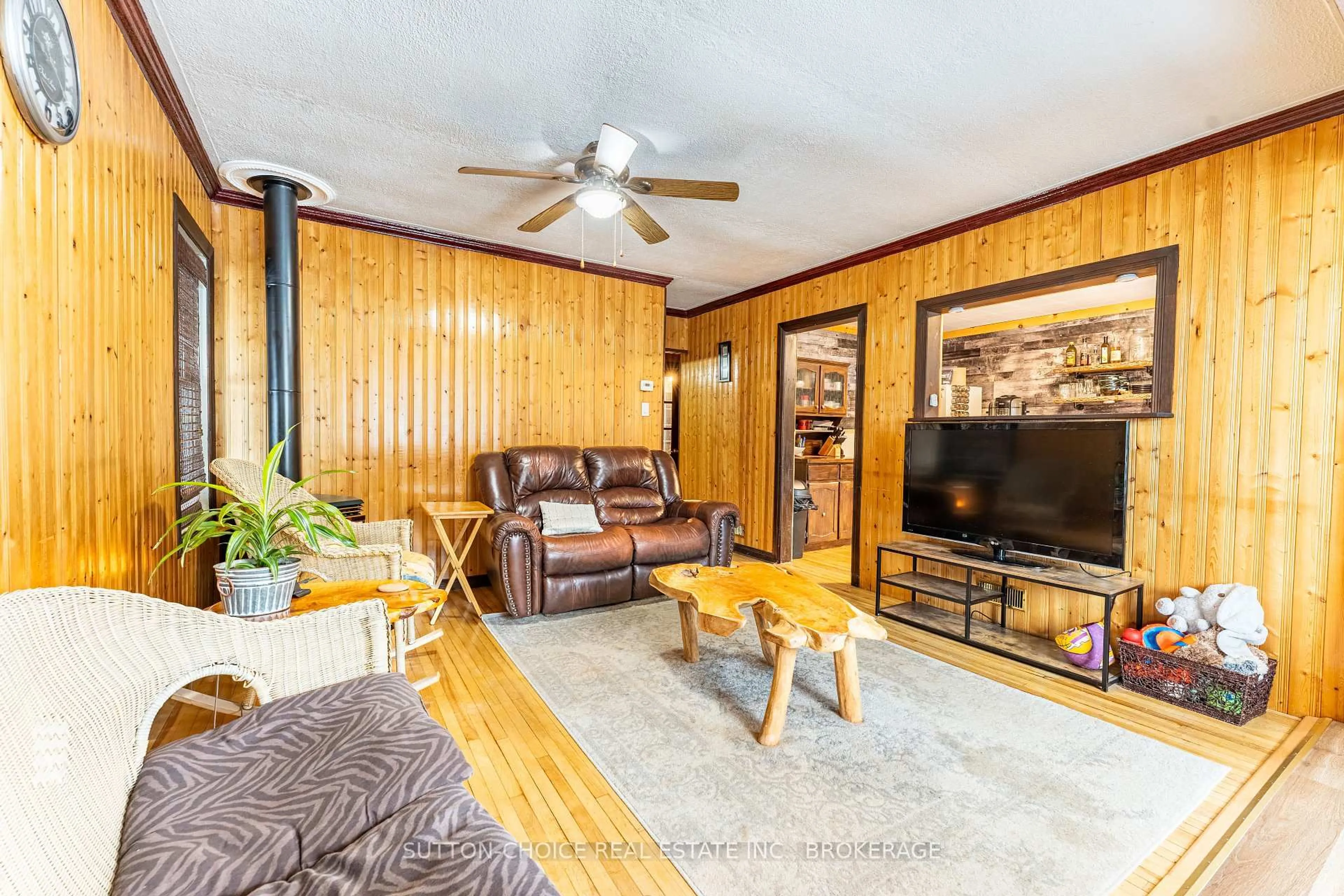 Living room with furniture, wood/laminate floor for 3 Pine St, Unorganized Townships Ontario P0H 2J0