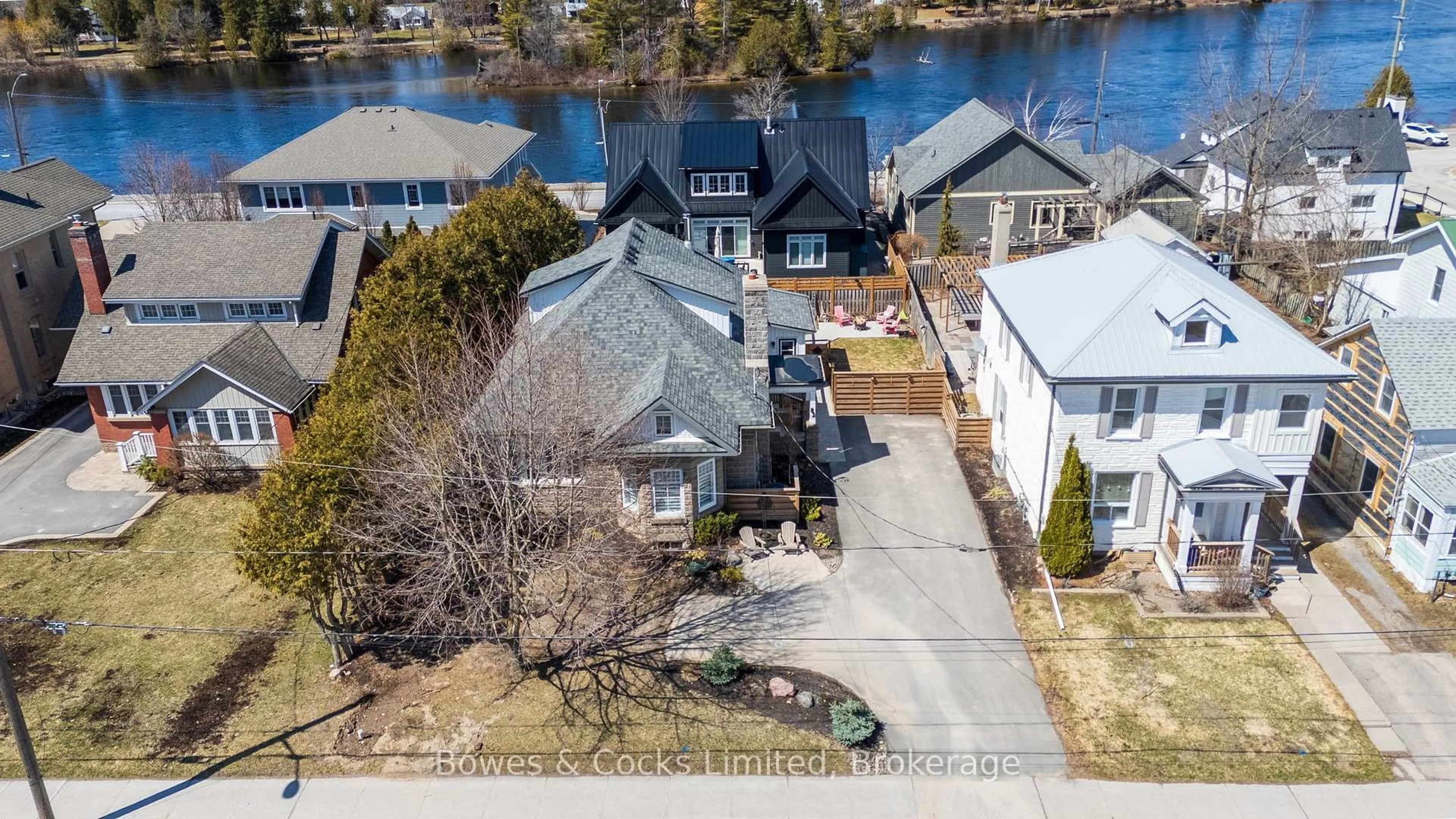 A pic from outside/outdoor area/front of a property/back of a property/a pic from drone, water/lake/river/ocean view for 82 Queen St, Selwyn Ontario K0L 2H0