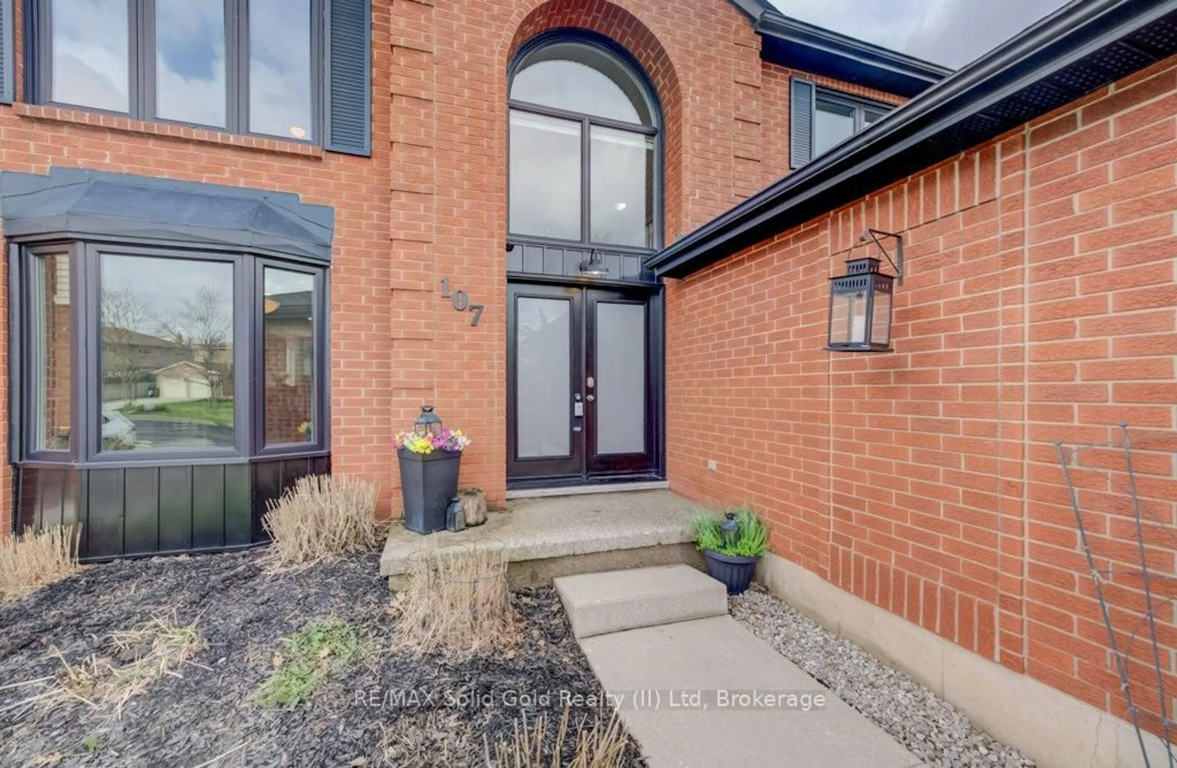 Home with brick exterior material, street for 107 Old Park Lane, Kitchener Ontario N2N 2K1