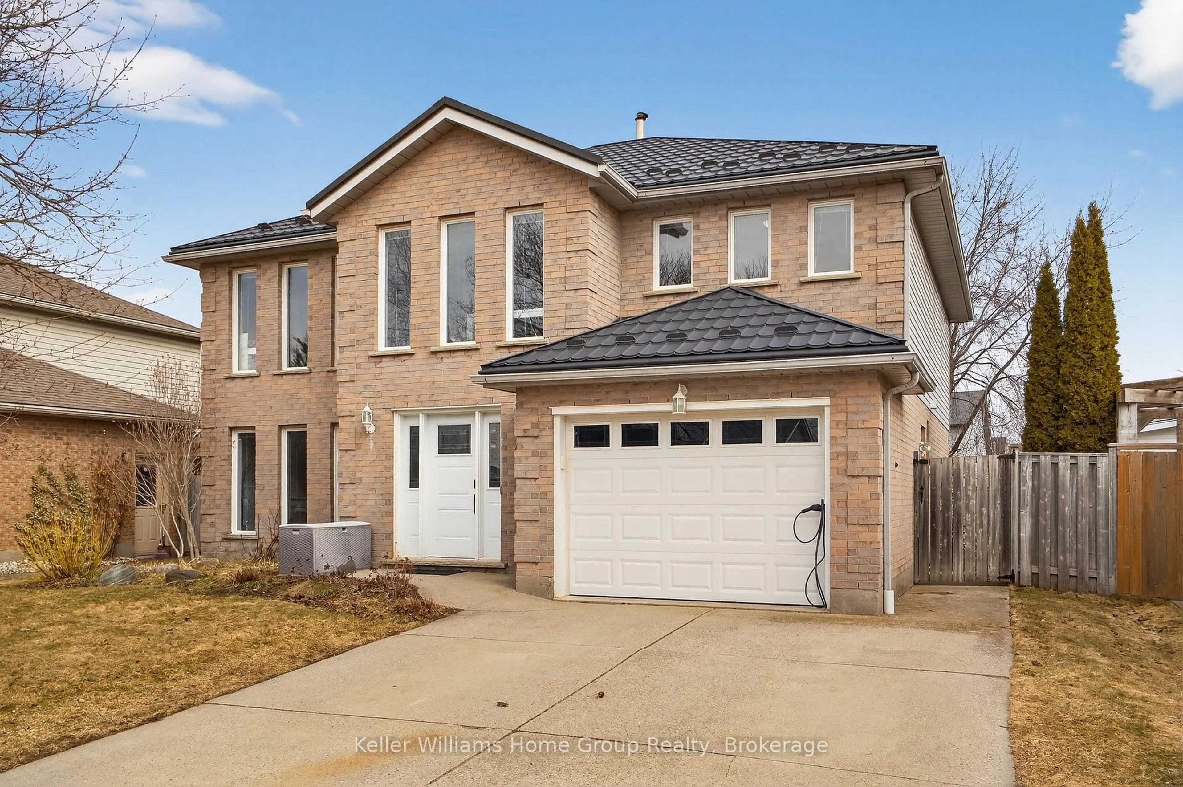 Home with brick exterior material, street for 42 Freshmeadow Way, Guelph Ontario N1K 1R9