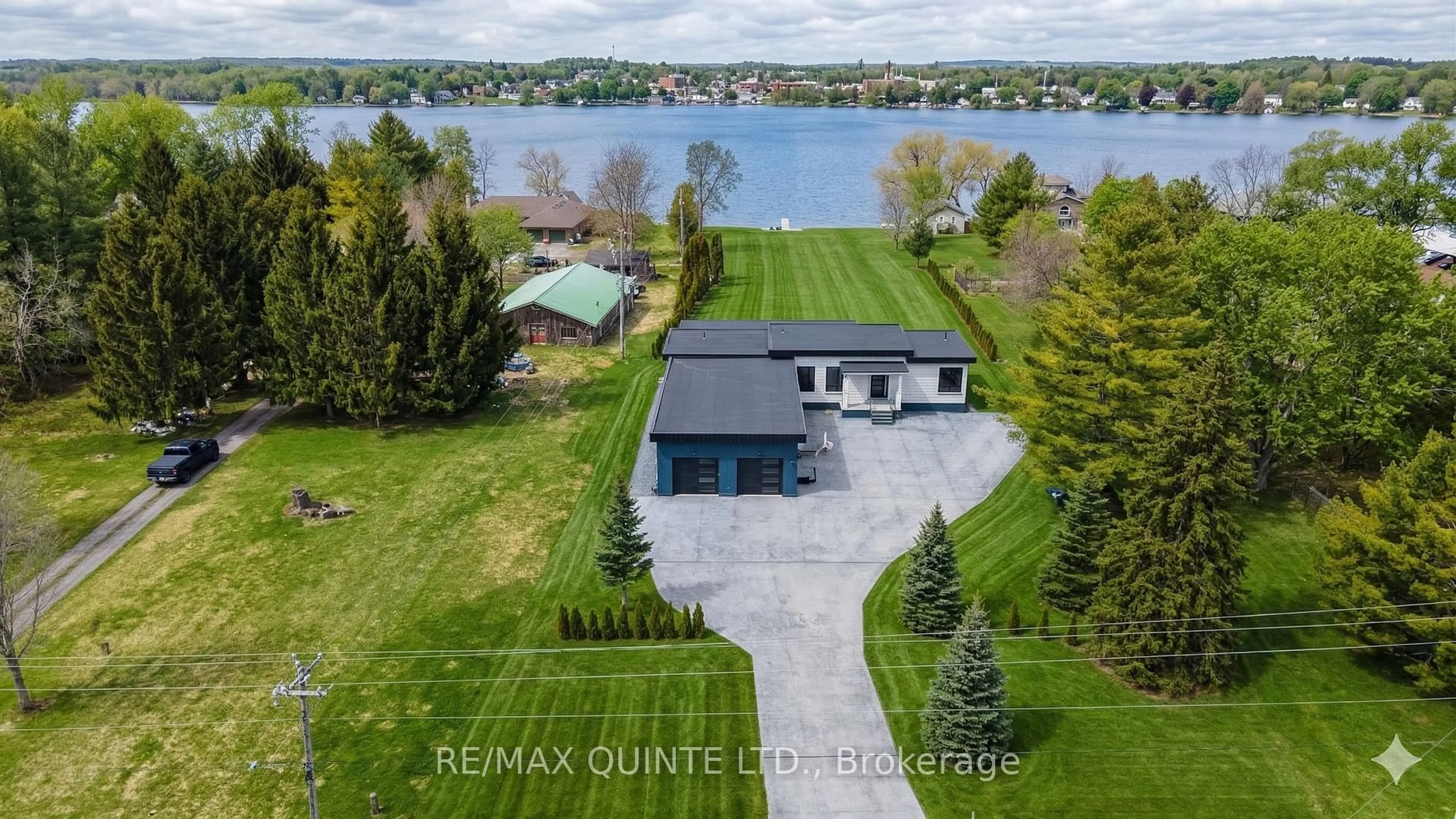 A pic from outside/outdoor area/front of a property/back of a property/a pic from drone, water/lake/river/ocean view for 2528 County Road 3, Prince Edward County Ontario K0K 1L0