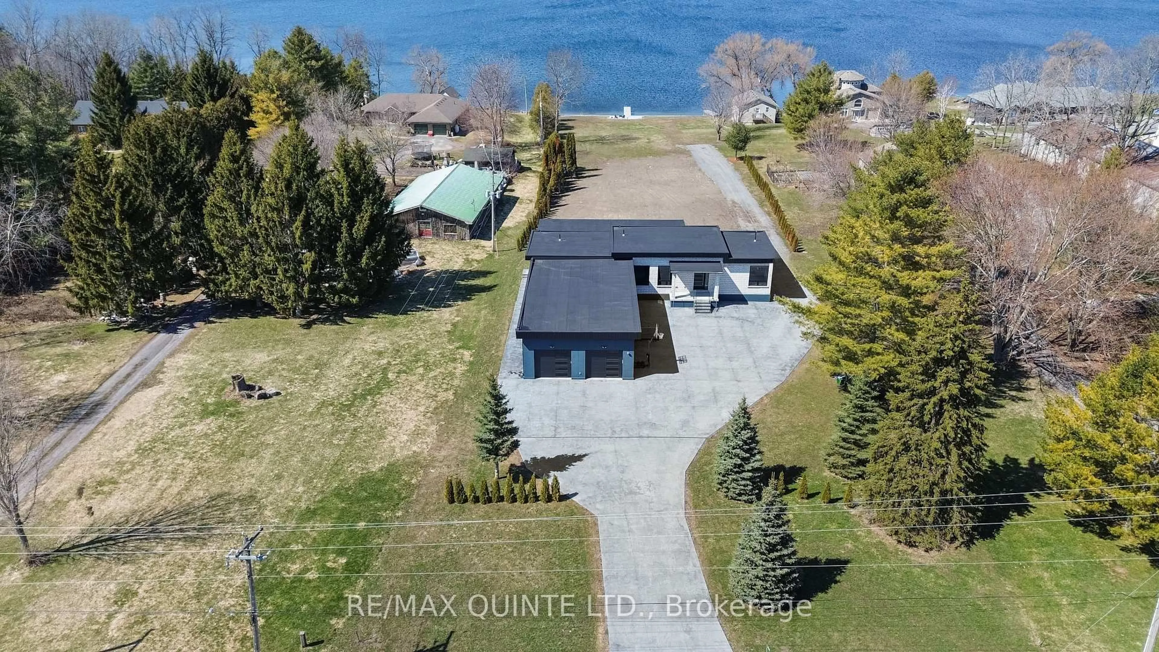 A pic from outside/outdoor area/front of a property/back of a property/a pic from drone, water/lake/river/ocean view for 2528 County Road 3, Prince Edward County Ontario K0K 1L0