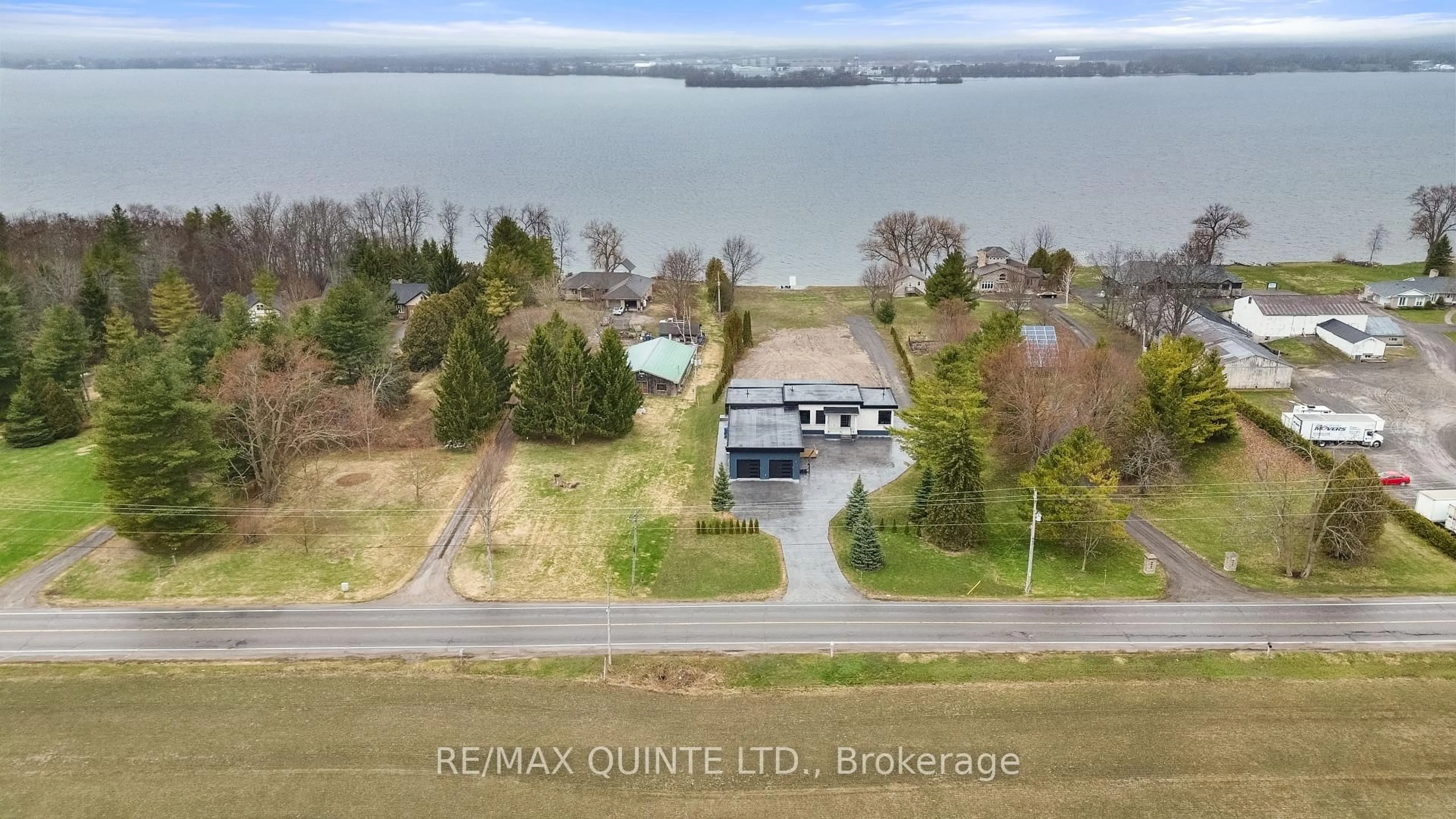 A pic from outside/outdoor area/front of a property/back of a property/a pic from drone, water/lake/river/ocean view for 2528 County Road 3, Prince Edward County Ontario K0K 1L0
