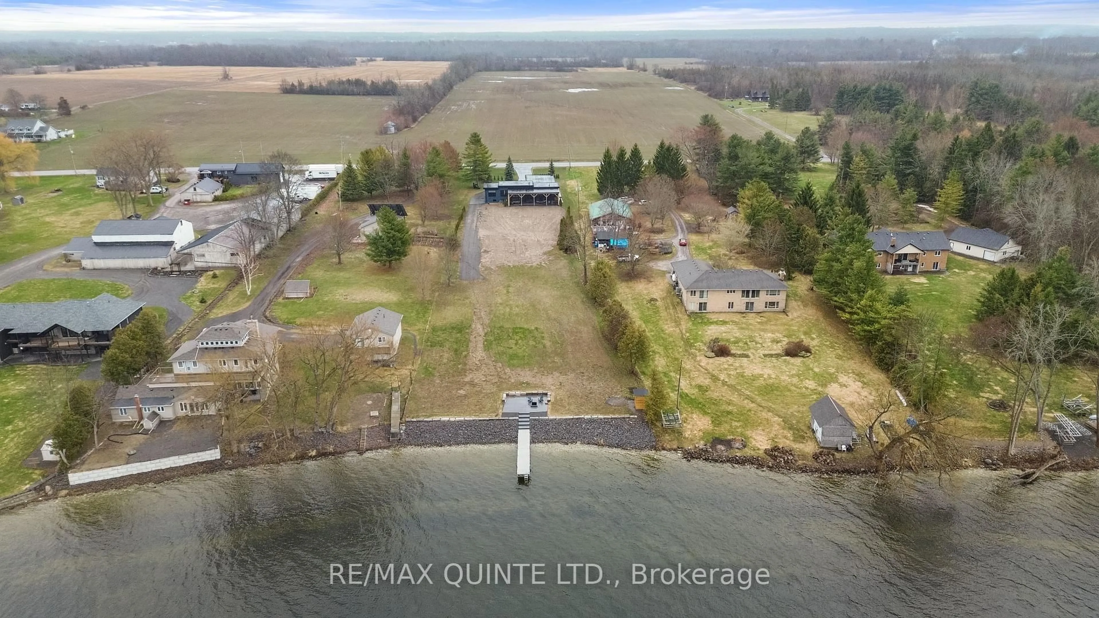 A pic from outside/outdoor area/front of a property/back of a property/a pic from drone, water/lake/river/ocean view for 2528 County Road 3, Prince Edward County Ontario K0K 1L0