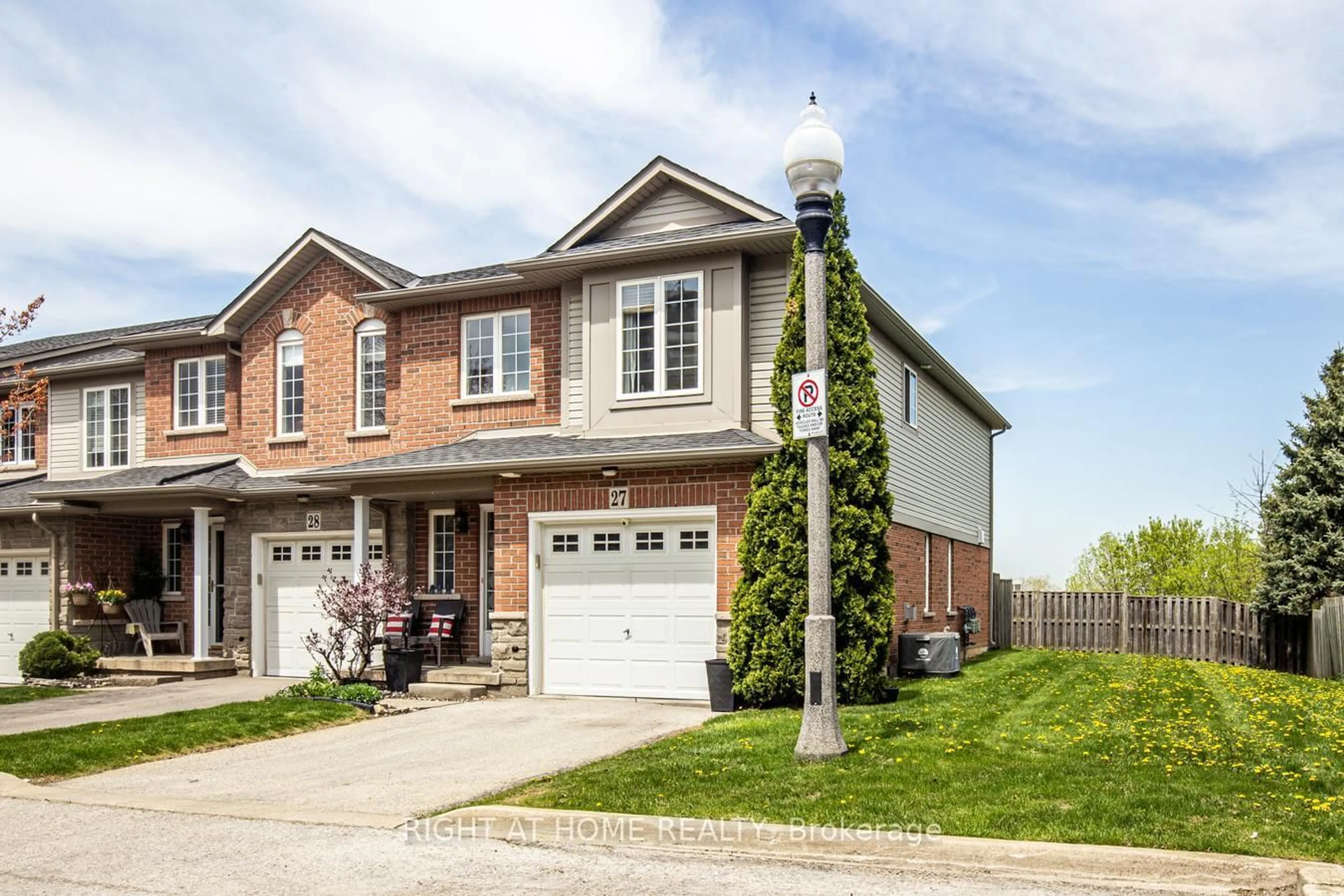 Home with brick exterior material, street for 7 Southside Pl #27, Hamilton Ontario L9C 7W6