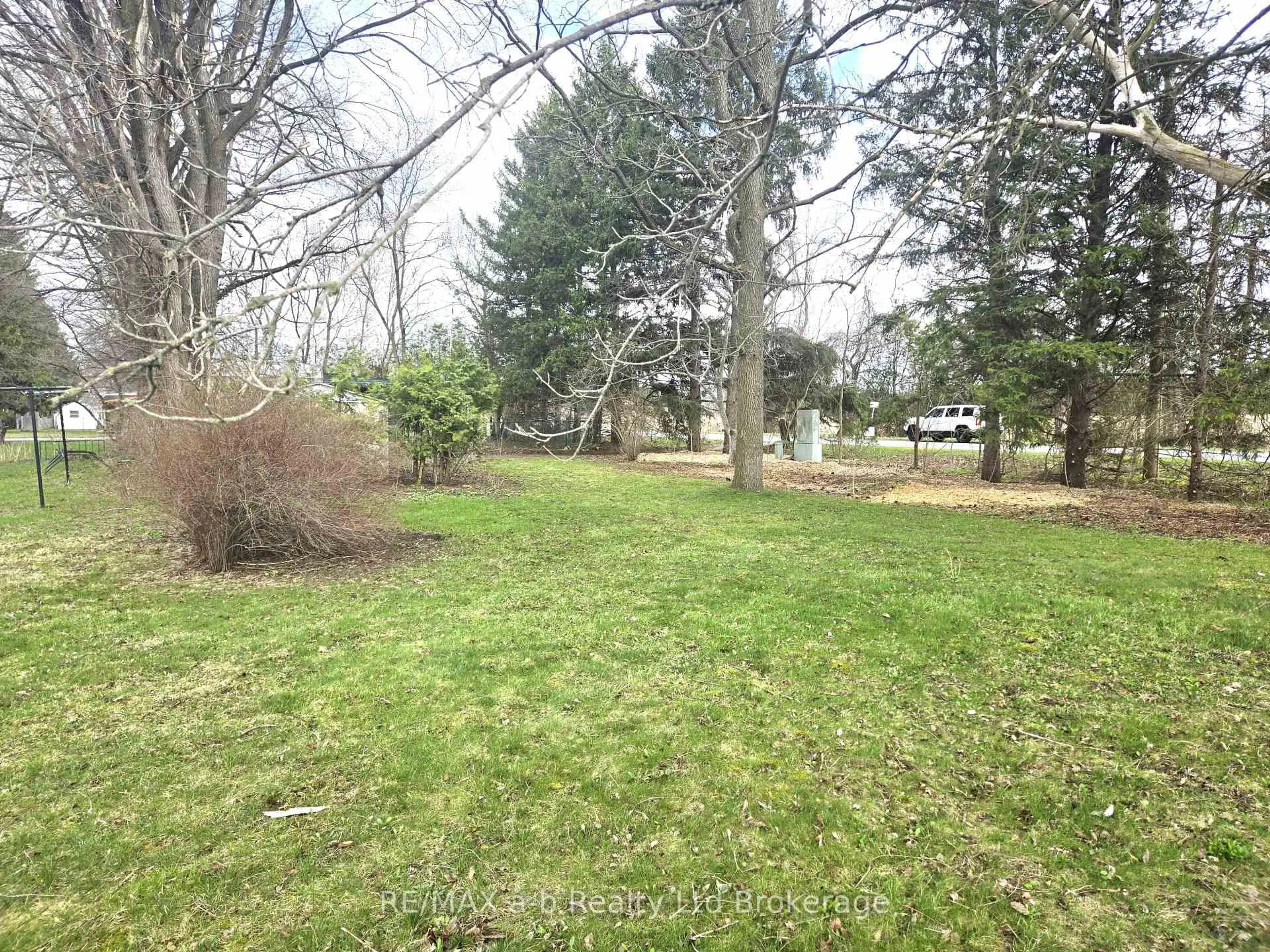 A pic from outside/outdoor area/front of a property/back of a property/a pic from drone, forest/trees view for 1 First St, Norfolk Ontario N4B 2W6