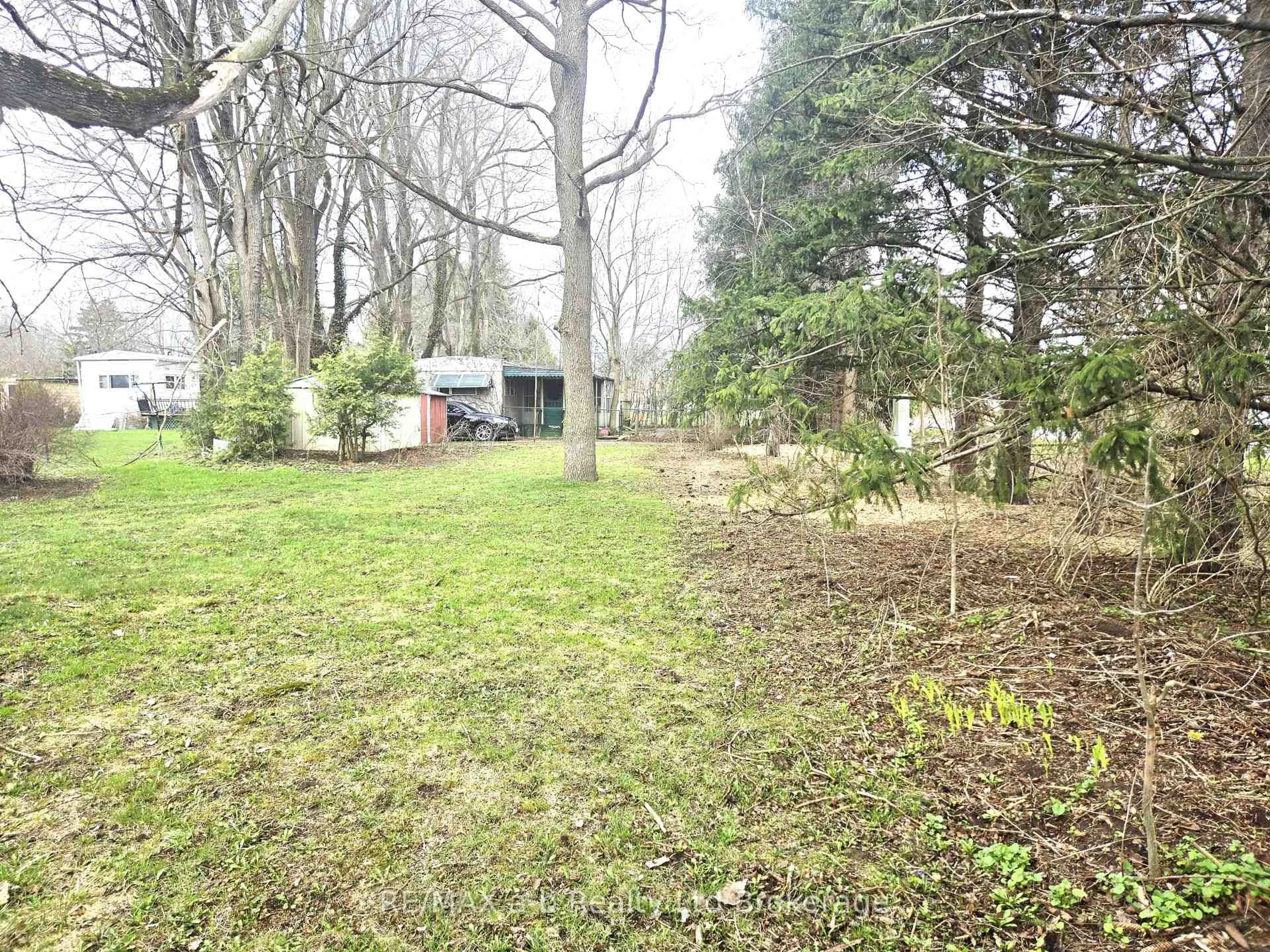 A pic from outside/outdoor area/front of a property/back of a property/a pic from drone, forest/trees view for 1 First St, Norfolk Ontario N4B 2W6