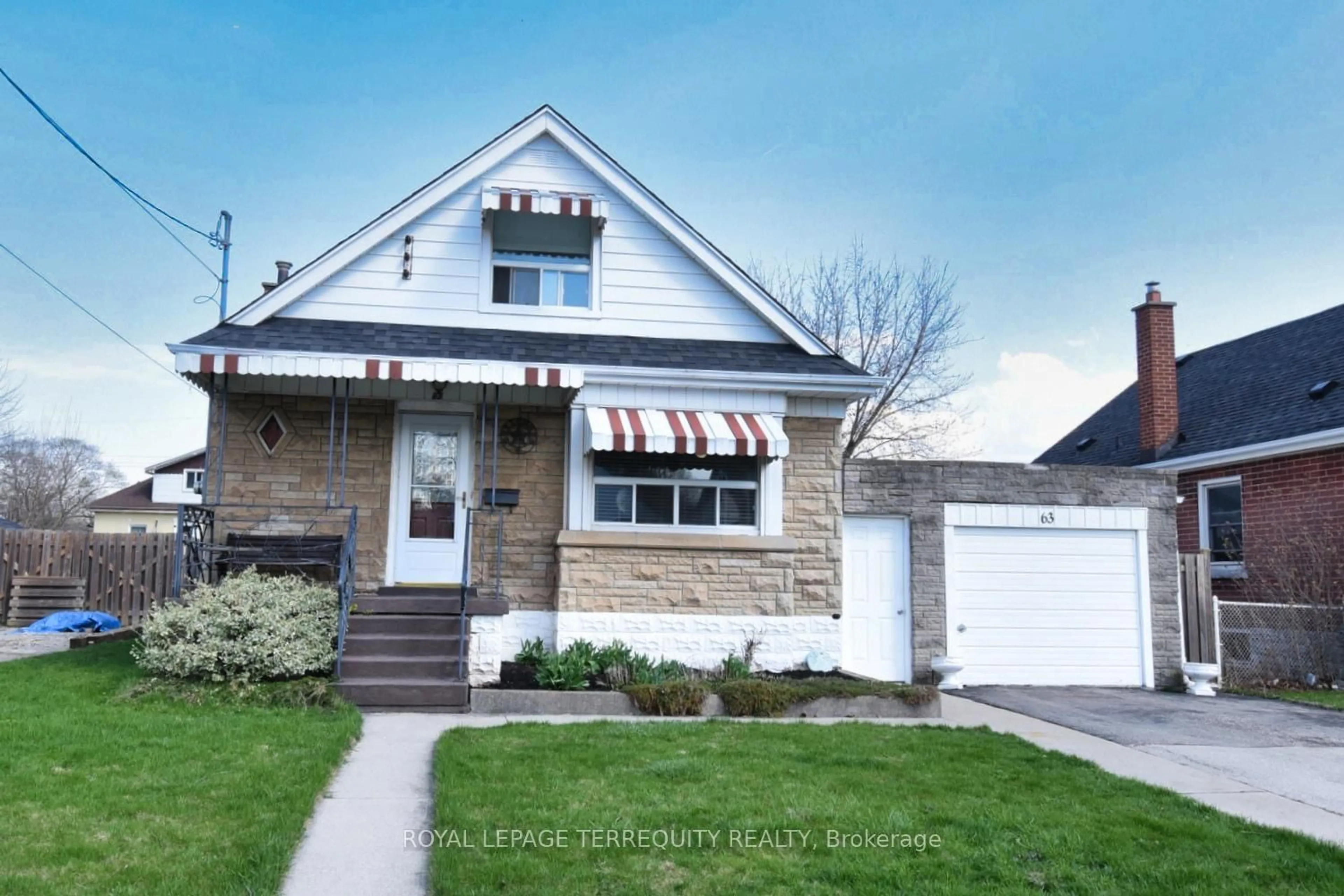 Home with vinyl exterior material, street for 63 West 1st St, Hamilton Ontario L9C 3C2