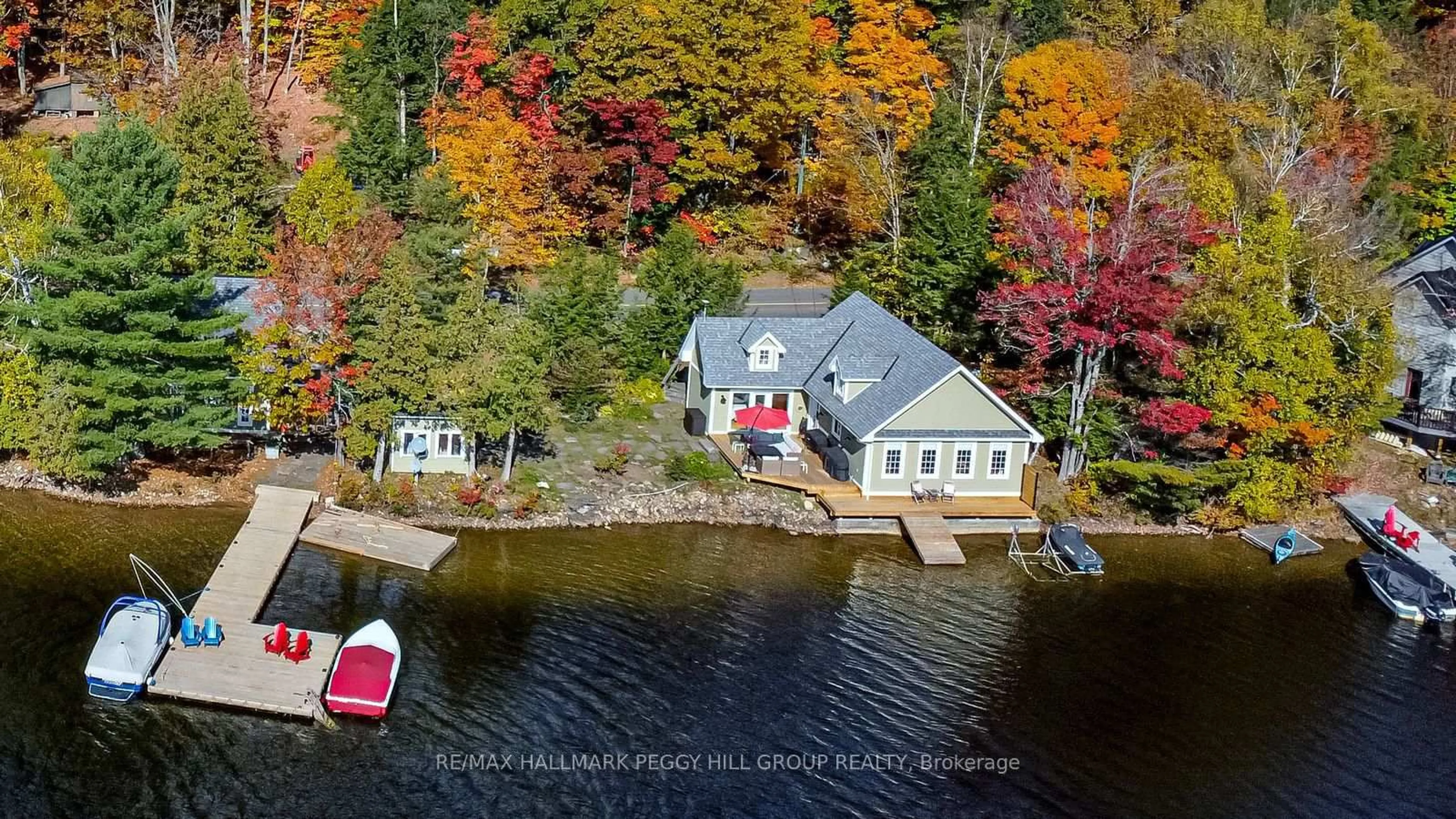 A pic from outside/outdoor area/front of a property/back of a property/a pic from drone, water/lake/river/ocean view for 3978 South Portage Rd, Huntsville Ontario P1H 2J3