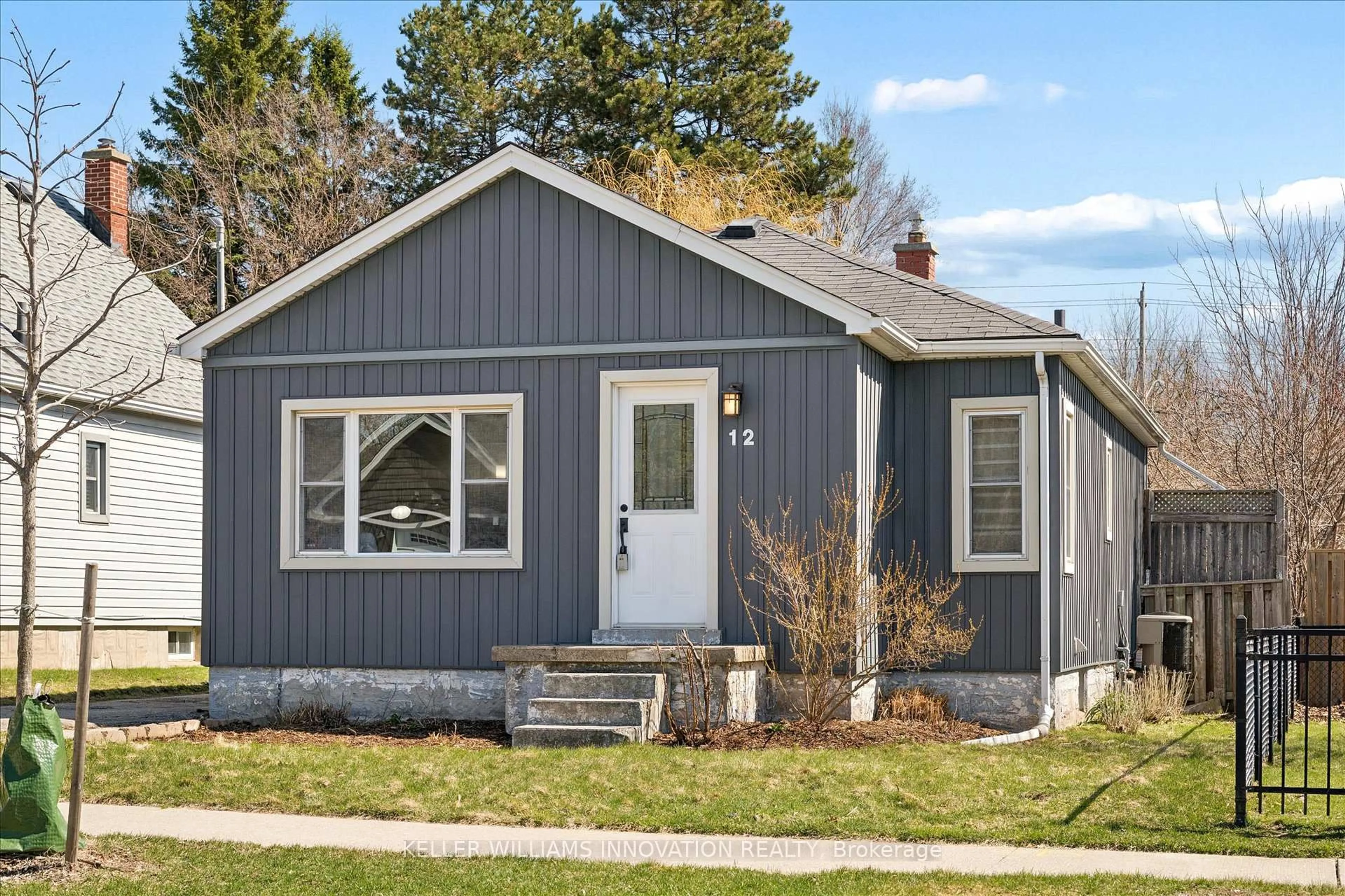 Home with vinyl exterior material, street for 12 St Vincent St, Kitchener Ontario N2H 4R2