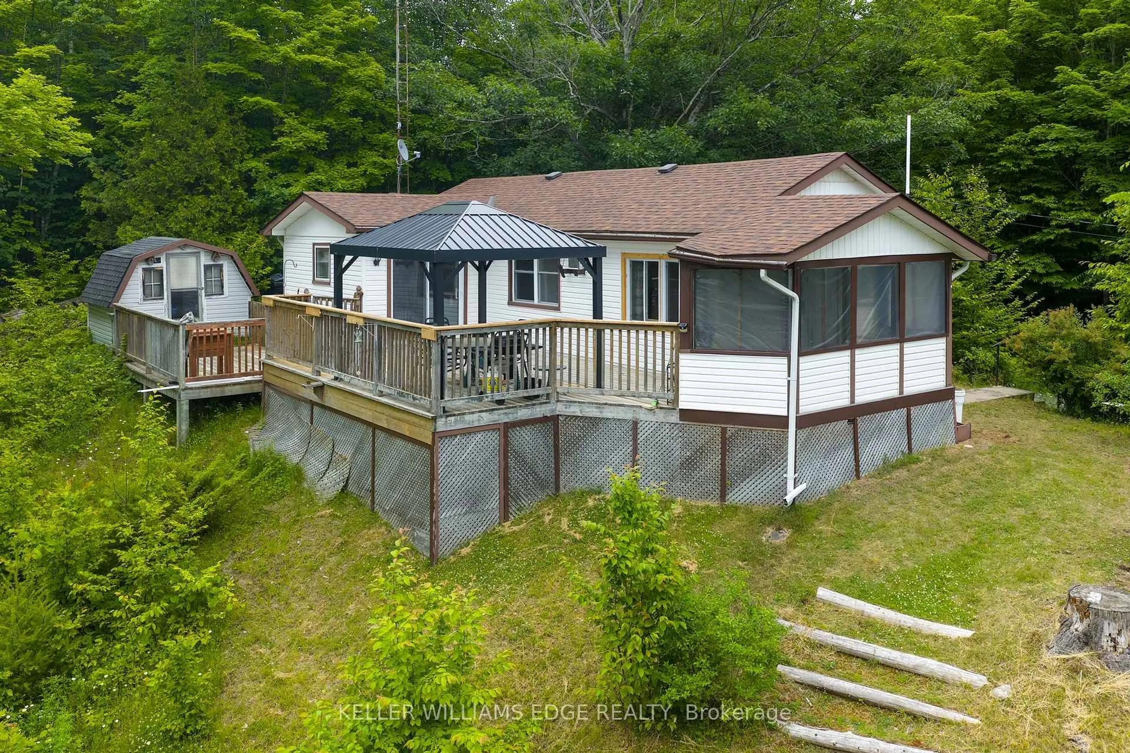A pic from outside/outdoor area/front of a property/back of a property/a pic from drone, water/lake/river/ocean view for 1180 Guigue Rd, Sharbot Lake Ontario K0H 2P0