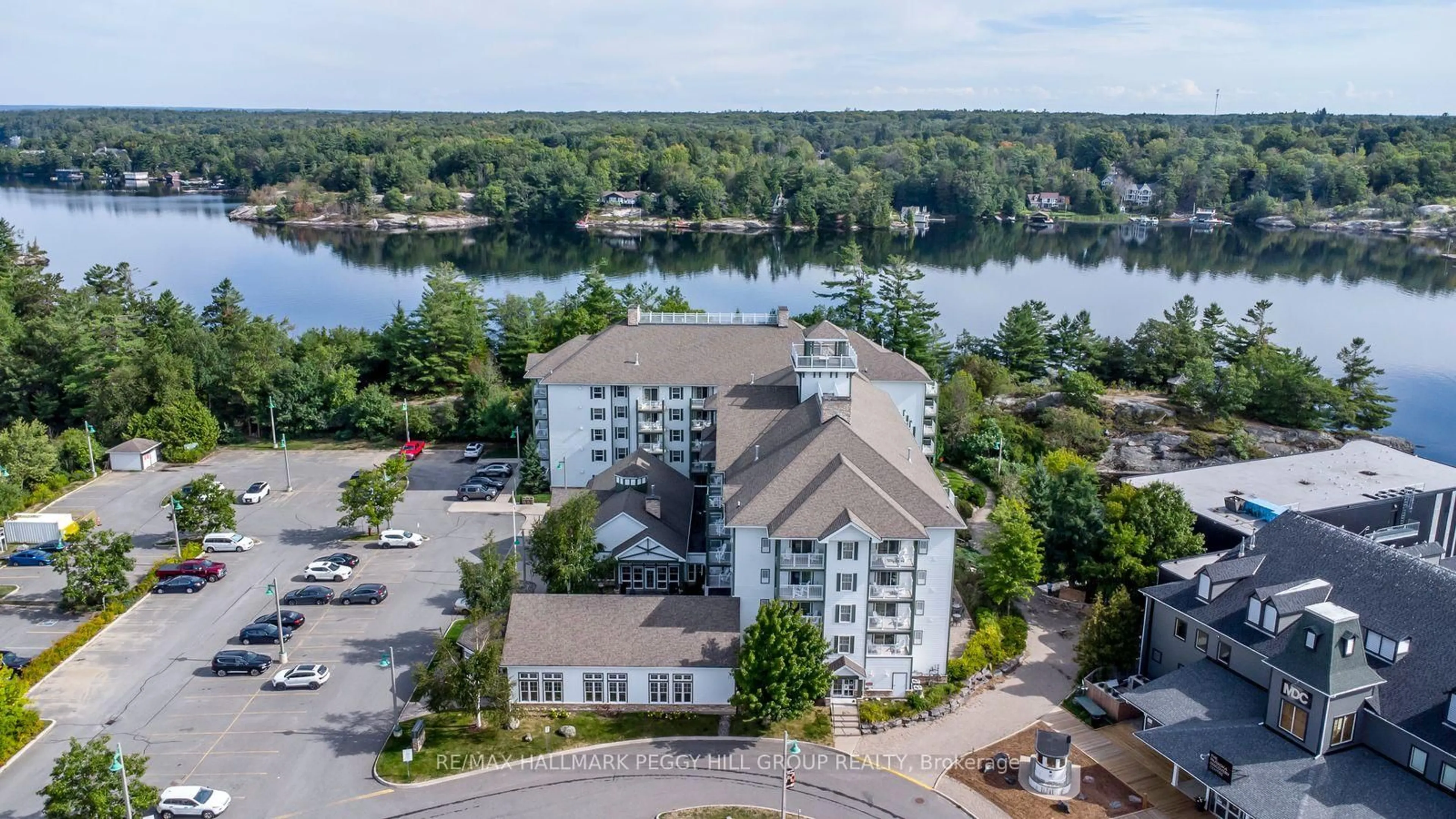 A pic from outside/outdoor area/front of a property/back of a property/a pic from drone, water/lake/river/ocean view for 285 Steamship Bay Rd #410, Gravenhurst Ontario P1P 1Z9