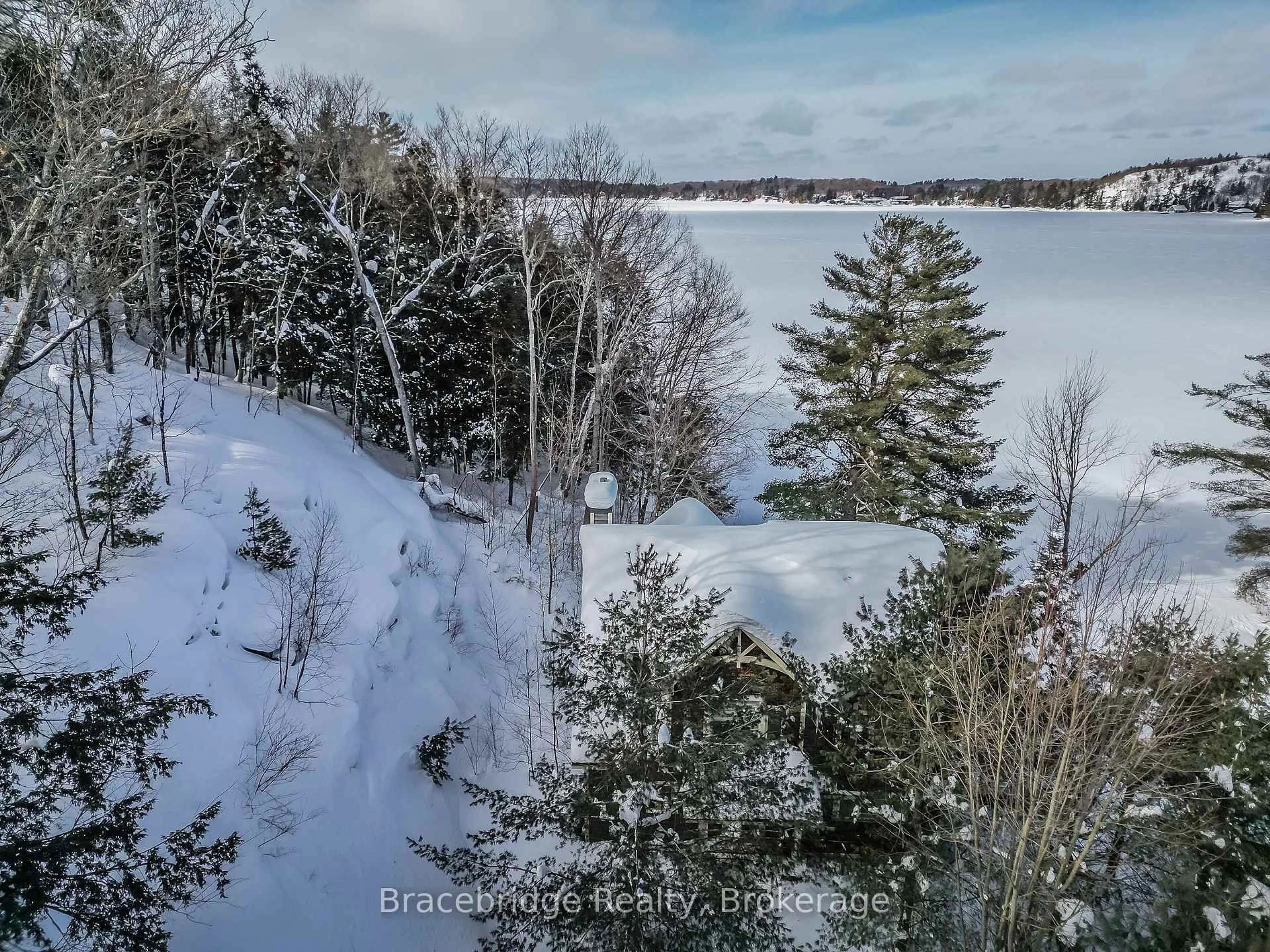 A pic from outside/outdoor area/front of a property/back of a property/a pic from drone, water/lake/river/ocean view for 3876 Muskoka Rd 118 Highway #Water's Edge W1, Muskoka Lakes Ontario P0B 1J0