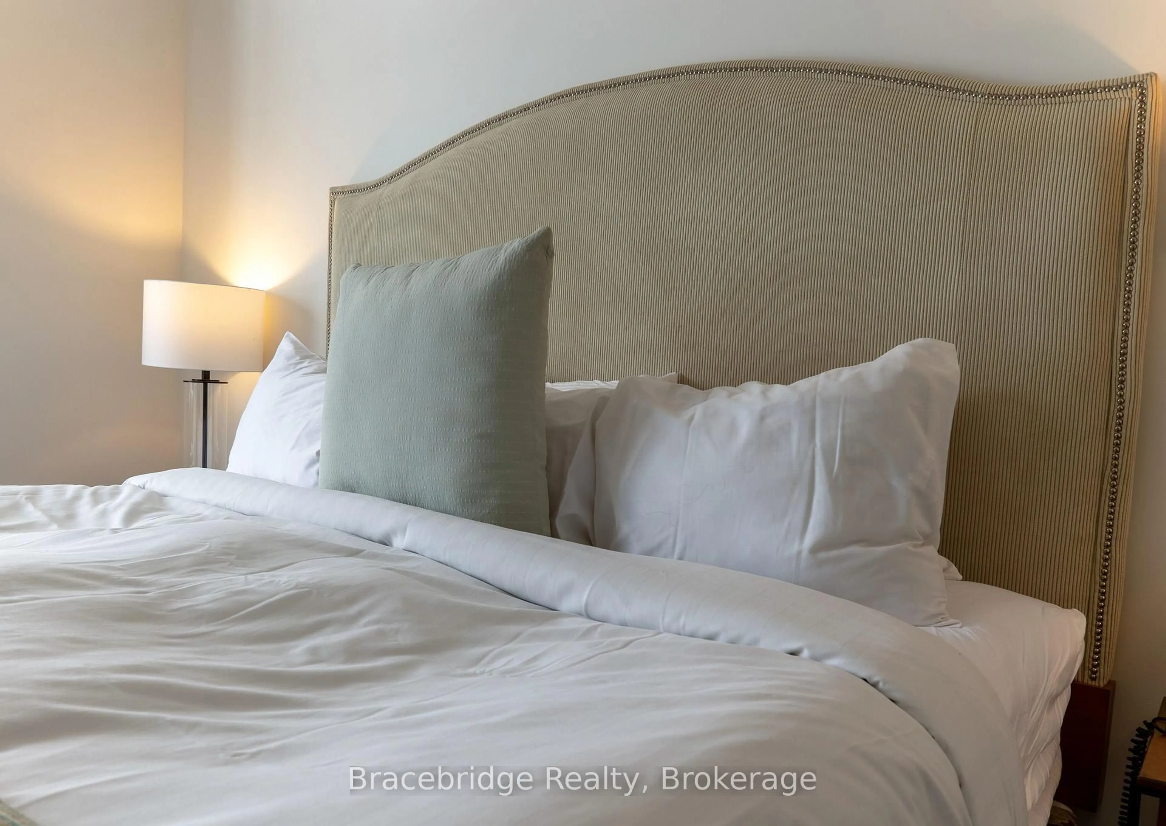 Bedroom with bed, floor is not visible for 1869 Muskoka Rd 118 Highway #L215-C2, Muskoka Lakes Ontario P1L 1W8