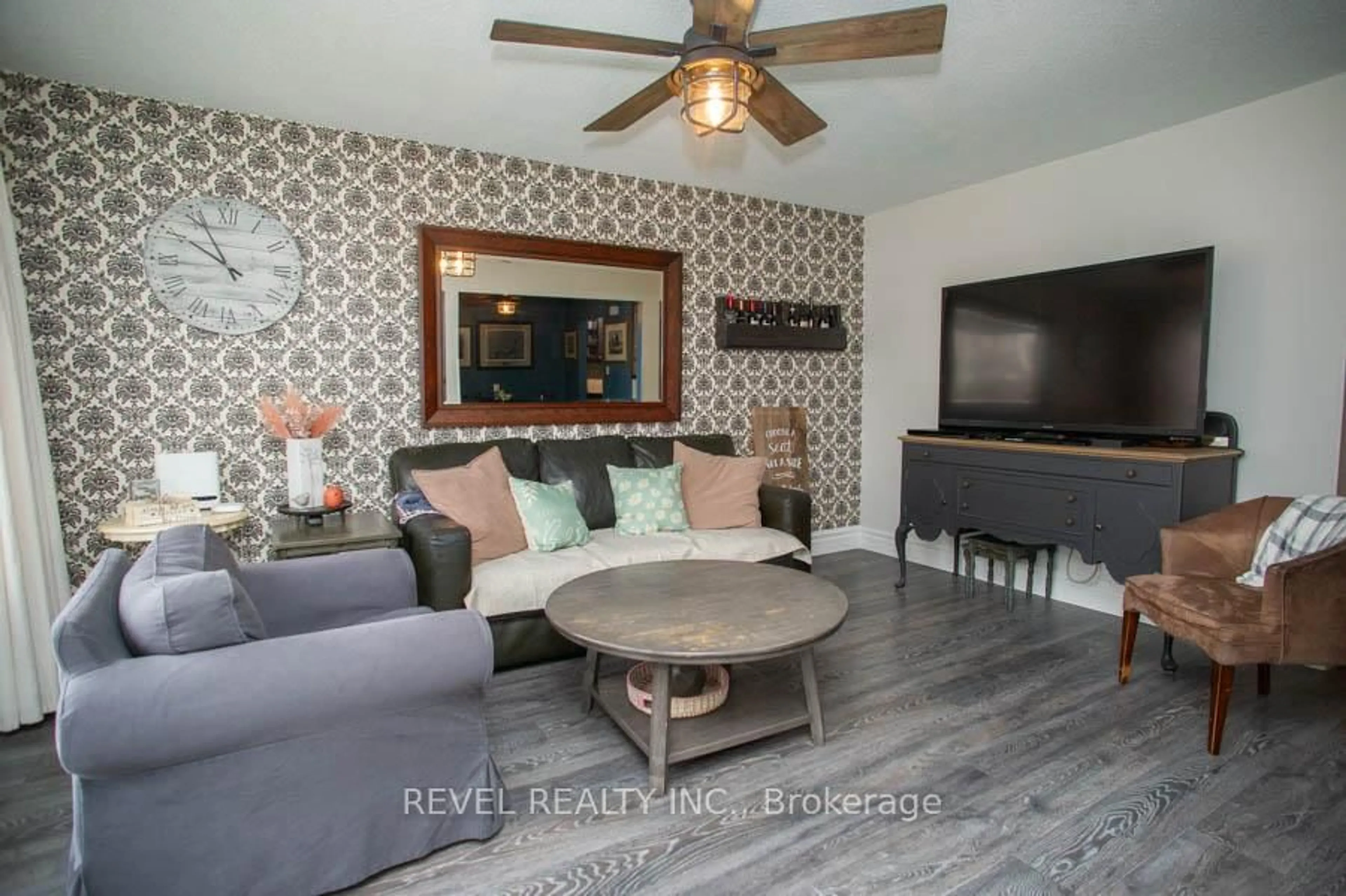 Living room with furniture, wood/laminate floor for 102 Century Hill Dr, Kitchener Ontario N2E 2H8