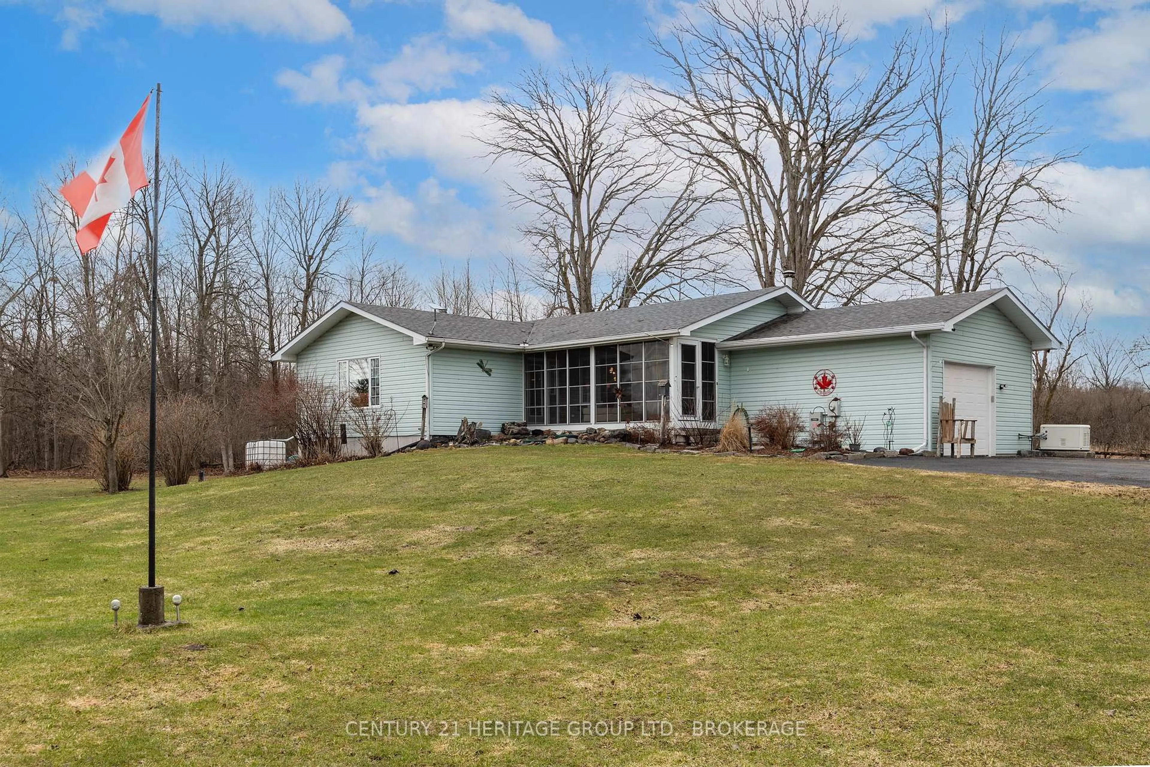 A pic from outside/outdoor area/front of a property/back of a property/a pic from drone, water/lake/river/ocean view for 5453 Petworth Rd, Harrowsmith Ontario K0H 1V0