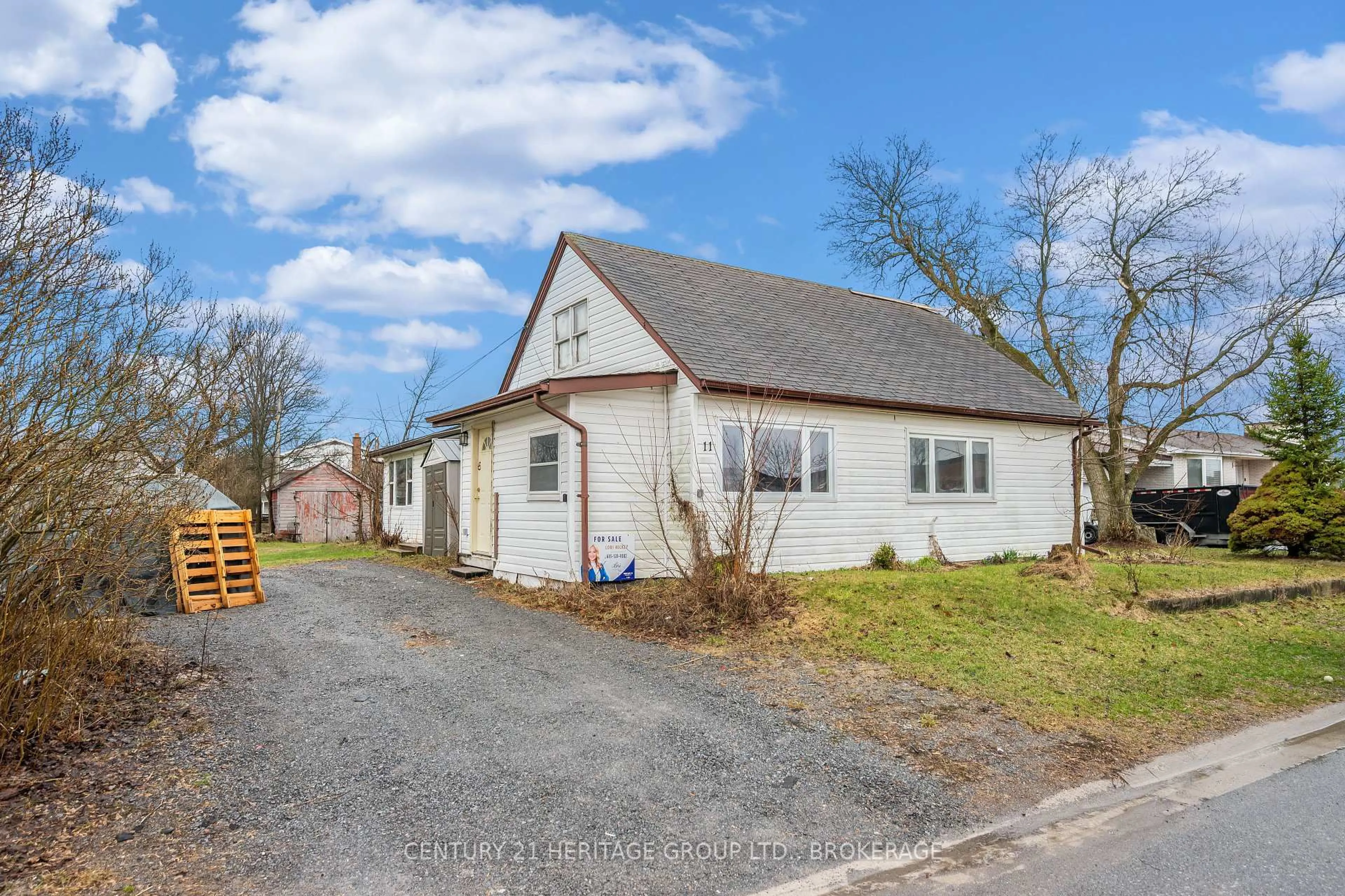 A pic from outside/outdoor area/front of a property/back of a property/a pic from drone, street for 11 North St, Bissett Creek Ontario K0H 2H0